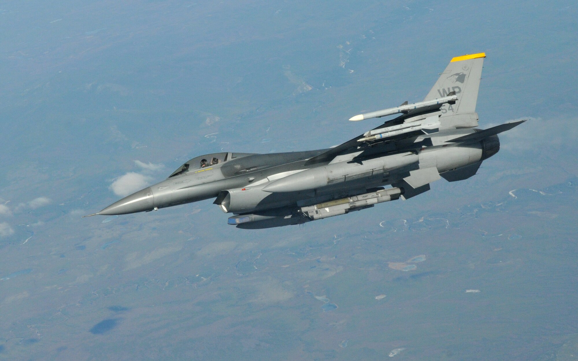 An F-16 Fighting Falcons pilot (NAMEXX) with the 8th Fighter Wing's 80th Fighter Squadron, Kunsan Air Base, Republic of Korea, moves into position as he waits for the rest of his four-ship to refuel from a KC-135 Stratotanker from Fairchild Air Force Base, Wash., during Red Flag-Alaska April 27. Red Flag-Alaska is a 10-day air combat training exercise that provides joint offensive, counter-air, interdiction, close air support and large force employment training in a simulated combat environment. (U.S. Air Force photo/Capt. Shannon Collins)