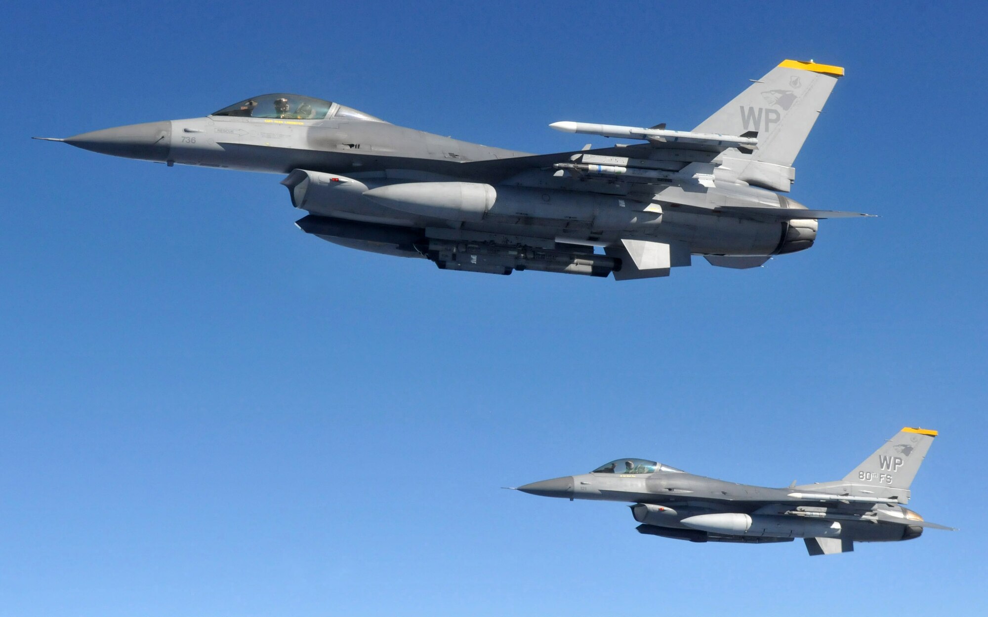 Two F-16 Fighting Falcons pilots with the 8th Fighter Wing's 80th Fighter Squadron, Kunsan Air Base, Republic of Korea, maintain their position as they wait for the rest of their four-ship to refuel from a KC-135 Stratotanker from Fairchild Air Force Base, Wash., during Red Flag-Alaska April 27. Red Flag-Alaska is a 10-day air combat training exercise that provides joint offensive counter-air, interdiction, close air support and large force employment training in a simulated combat environment. (U.S. Air Force photo/Capt. Shannon Collins)
