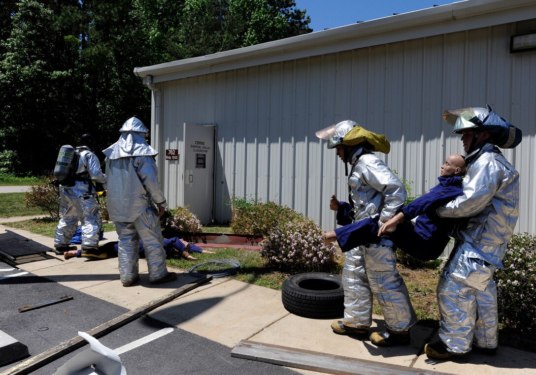 LANGLEY AIR FORCE BASE, Va. -- Firefighter’s with the 633d Civil Engineer Squadron, remove injured causalities from the scene during a Major Accident Response Exercise April 29. This is the first time Langley’s held a MARE with a tornado scenario, testing first responders and base personnel’s preparedness and ability to respond to a natural disaster. (U.S. Air Force photo/Senior Airman Dana Hill)
