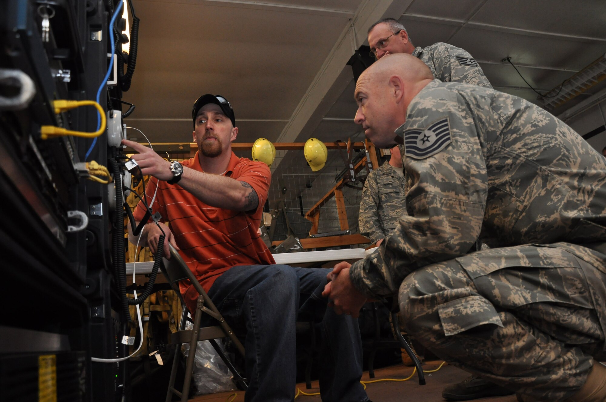 Tech. Sgt. Scott Inwards (right) of the 934th  Communications Flight recieves training from Program Manager Eric Brown on setting up network connections of the emergency communications package during initial setup up here. The 934th Communications Flight has received a new mission coordinating emergency communication during man made or natural disaster. (Air Force phot/Tech. Sgt. Bob Sommer)