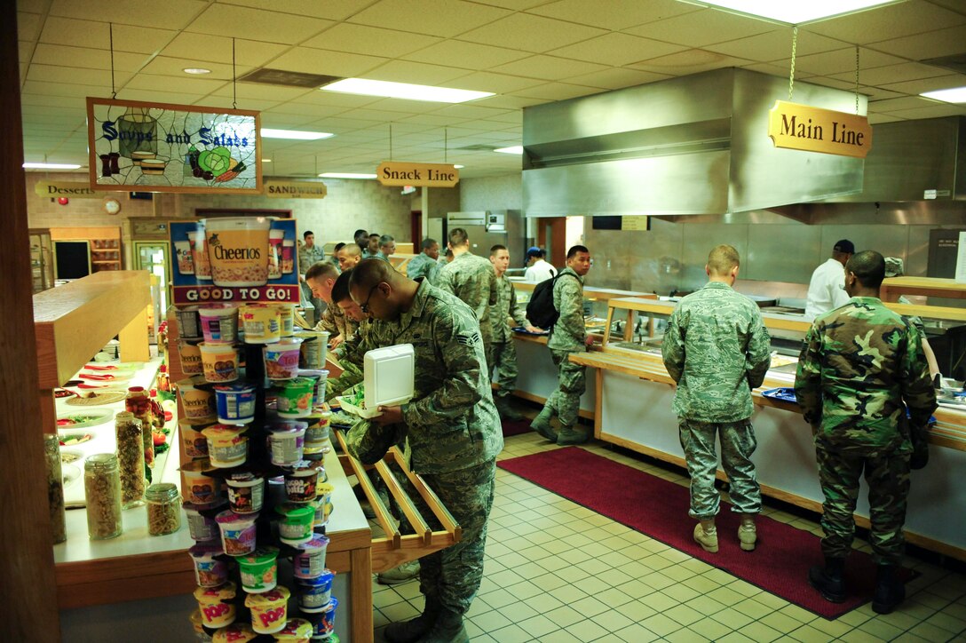 ELLSWORTH AIR FORCE BASE, S.D. - Airmen are served lunch at the Bandit Inn Dining Facility, April 27.  The Bandit Inn, built in 1983, serves approximately 600 people a day.  (U.S. Air Force photo/Airman 1st Class Corey Hook)
