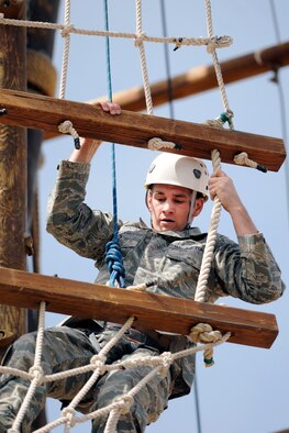 Second Lt. Joshua Meents navigates the Ropes Course at the U.S. Air Force Academy April 15, 2010. Lieutenant Meents visited the Academy to speak at the Spring 2010 Falcon Heritage Forum, which was themed, Officers of Character: Lieutenants in Action." He is assigned to the 53rd Electronic Warfare Group, Detachment 1, at Nellis Air Force Base, Nev. (U.S. Air Force photo/Bill Evans)