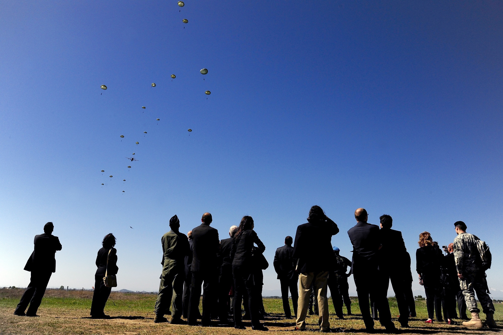 Bulgarian Minister of Defense Anu Anguelov and U.S. Ambassador to Bulgaria James B. Warlick Jr. and their staff watch U.S. and Bulgarian paratroopers jump from an Air Force C-130J during Operation Thracian Spring 2010's media day April 27, 2010, at Plovdiv Airport in Bulgaria. (U.S. Air Force photo/Master Sgt. Quinton T. Burris)