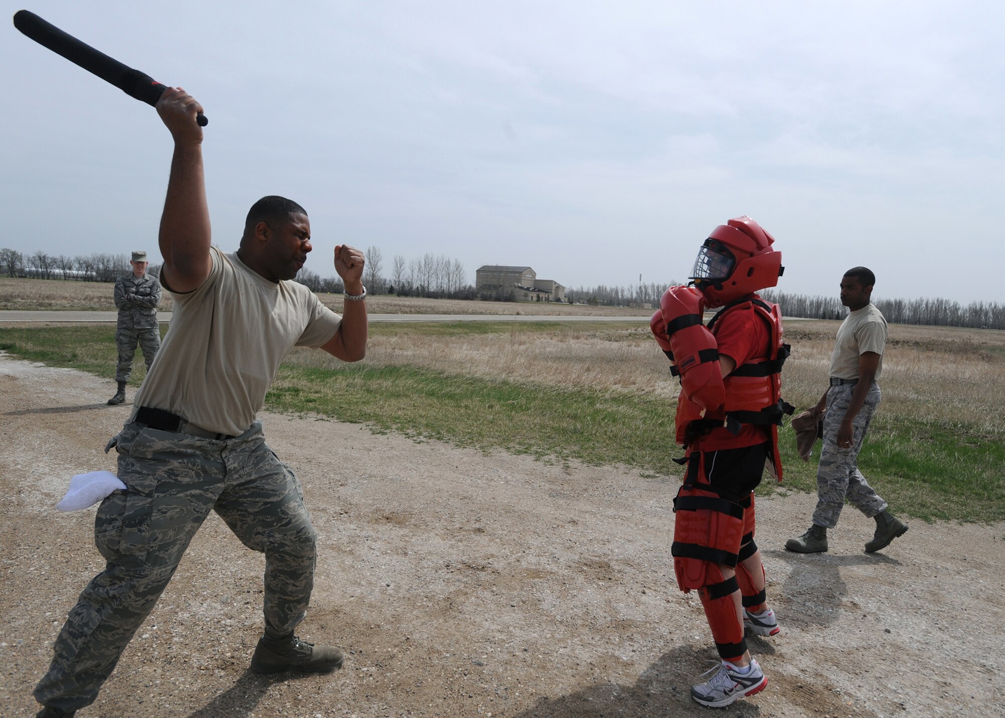 Staff Sergeant Elton Stevenson, 319th Security Forces Squadron, performs combative drills after being exposed to oleoresin capsicum also known as pepper spray April 23 on Grand Forks Air Force Base, N.D.  Sgt. Elton must be experienced with OC so he can be a certified handler. The Intra Service Non-Lethal Weapons training course serves two purposes, first, knowing what it’s like if exposed and second, knowing how to handle a suspect when exposed to OC. (U.S. Air Force photo by Airman 1st Class Amber Price)