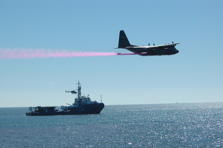 Aircraft and crews from the Air Force Reserve Command’s 910th Airlift Wing, Youngstown Air Reserve Station, Ohio, were notified April 29, 2010, that they will support the oil spill recovery effort in the Gulf of Mexico. The 910th AW specializes in aerial spray and is the Department of Defense’s only large area fixed wing aerial spray unit. In this Nov. 8, 2006, file photo, a 910th AW C-130H flies low level above a simulated oil slick six miles off the shore of Galveston, Texas, during an oil dispersant exercise. (U.S. Air Force file photo)