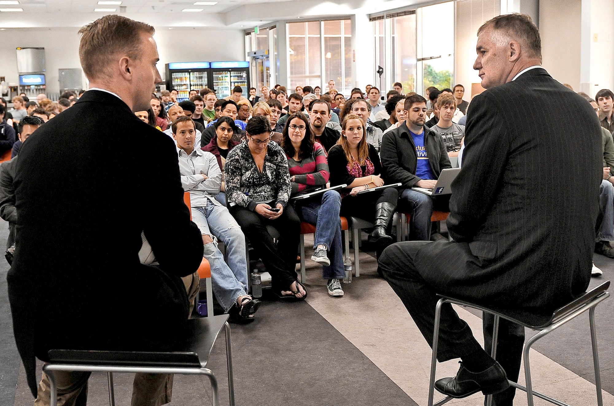 Deputy Defense Secretary William J. Lynn III (right) and former Marine Don Faul, director of online operations for the Facebook social media website, talk to Facebook employees in Silicon Valley, Calif., April 28, 2010.  (Defense Department photo/ Master Sgt. Jerry Morrison) 