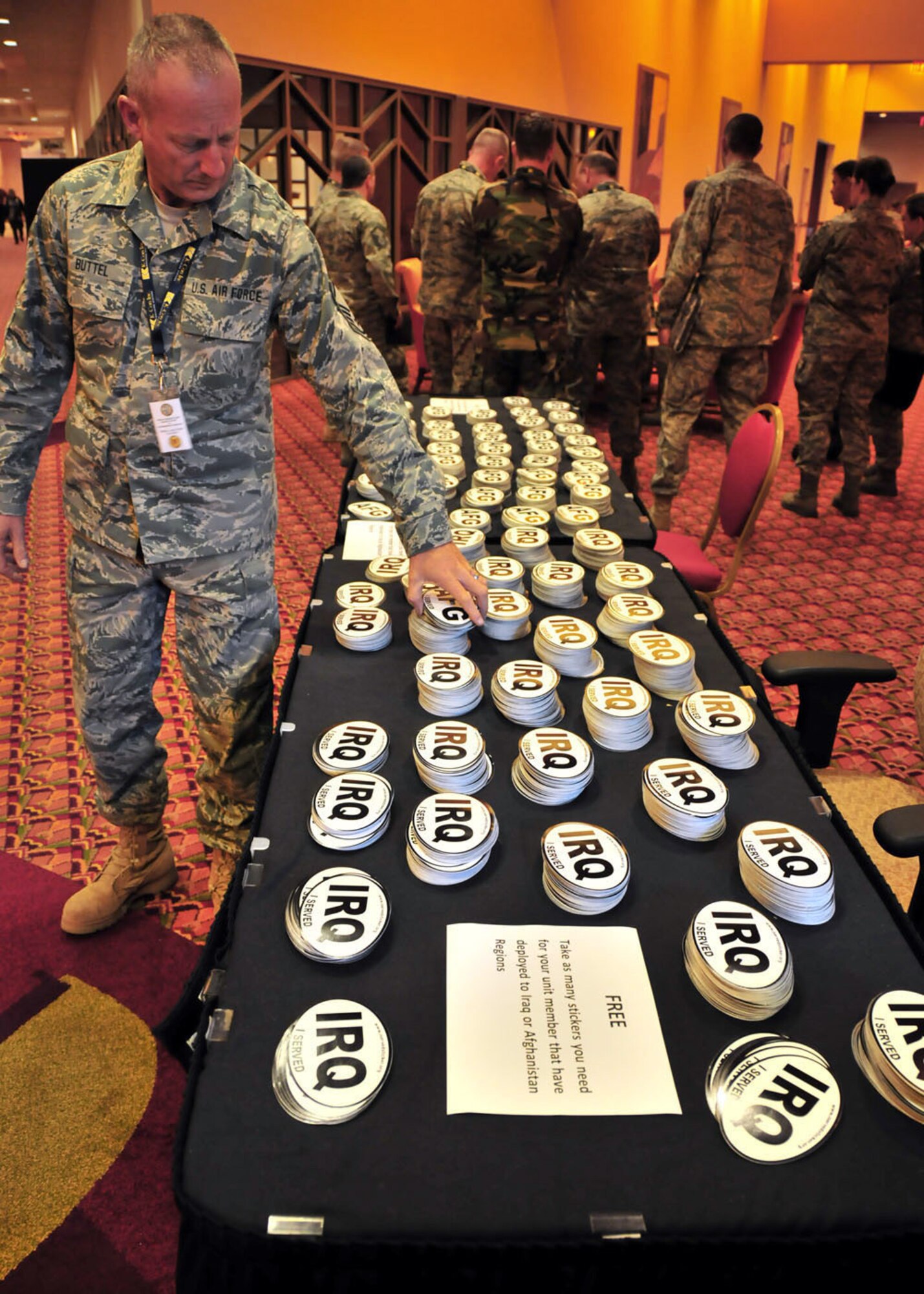 Deployment stickers for Iraq and Afghanistan are left out for Air National Guard civil engineers at the Civil Engineer and Security Forces Conference in Phoenix April 19-23, 2010. Across the country, thousands of construction and repair experts are in the midst of overseas deployments in historic numbers and scope. While whole units are deploying, leaving bases to manage in their absence, mobilization officials report improvements in notifications as well as in benefits. (U.S. Air Force photo by Master Sgt. Mike R. Smith, National Guard Bureau)