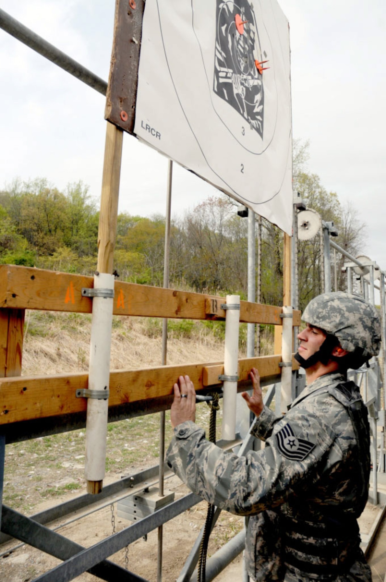 Tech. Sgt. Daniel Owczarczak of the 107th Security Forces Squadron of the New York Air National Guard marks and raises a target for a shooter during the zeroing phase of the 31st annual The Adjutant General Match held at Camp Smith, N.Y., April 16-18, 2010. Air Guard security forces personnel are deployed around the world and engaging in all Air Force security forces missions, except the Military Working Dog Program. (U.S. Army photo by Spc. Leigh Campbell, 138th Public Affairs Detachment)