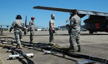 C-130 Hercules maintainers prepare to refill a Modular Airborne Fire Fighting System with pressurized water during an annual certification training April 28 during the 2010 Modular Airborne Firefighting System certification training in Greenville, S.C. The annually-held certification brought together more than 400 Air National Guard and Air Force Reserve Airmen and their unit's C-130s to receive certification from the U.S. Forest Service in aerial firefighting. The certification runs April 25-May 1. The maintenance Airmen are assigned to the Air Force Reserve's 302nd Airlift Wing. (U.S. Air Force photo/Tech. Sgt. Daniel Butterfield)