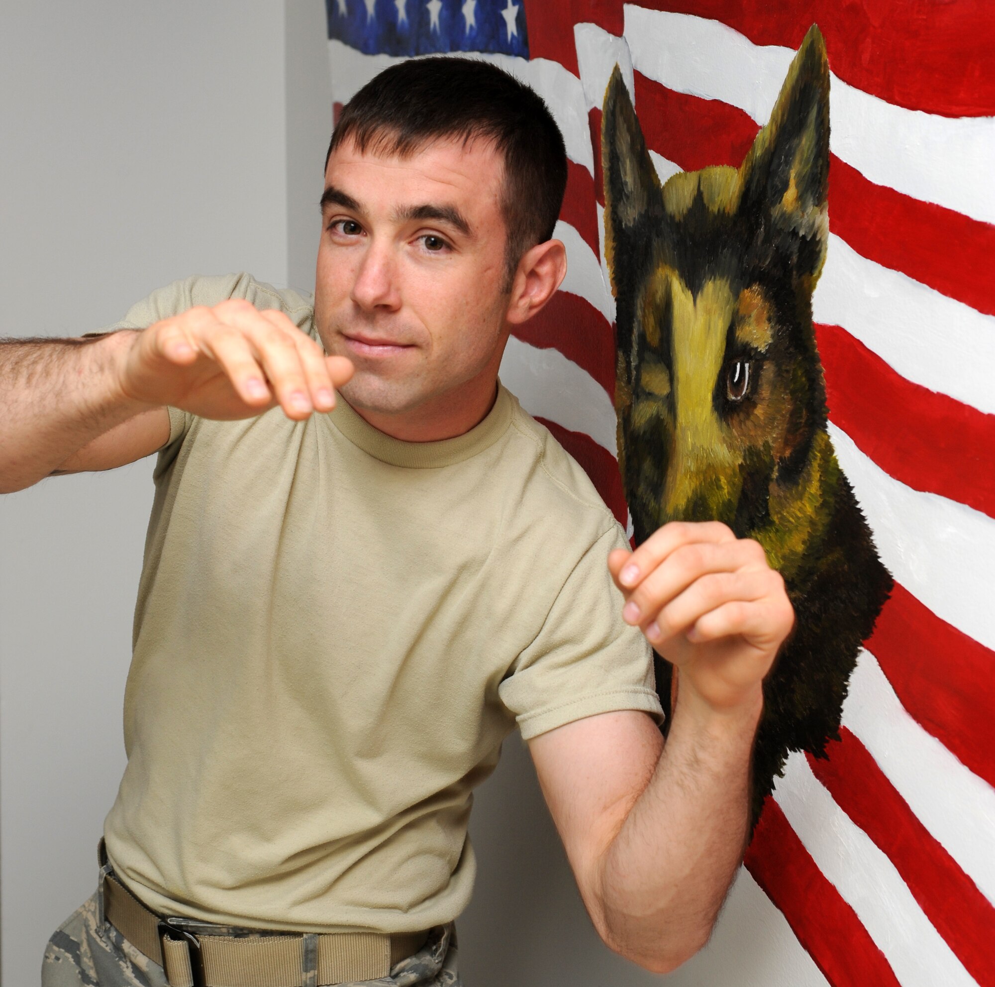 Staff Sgt. David Helmbrecht, a Military Working Dog Trainer with the 319th Security Forces Squadron at Grand Forks Air Force Base, N.D., keeps his hands relaxed while demonstrating some of his Mixed Martial Arts punches. Sergeant Helmbrecht will make his professional debut May 8 in a MMA fight. (U.S. Air Force photo by Airman 1st Class Amber Price)