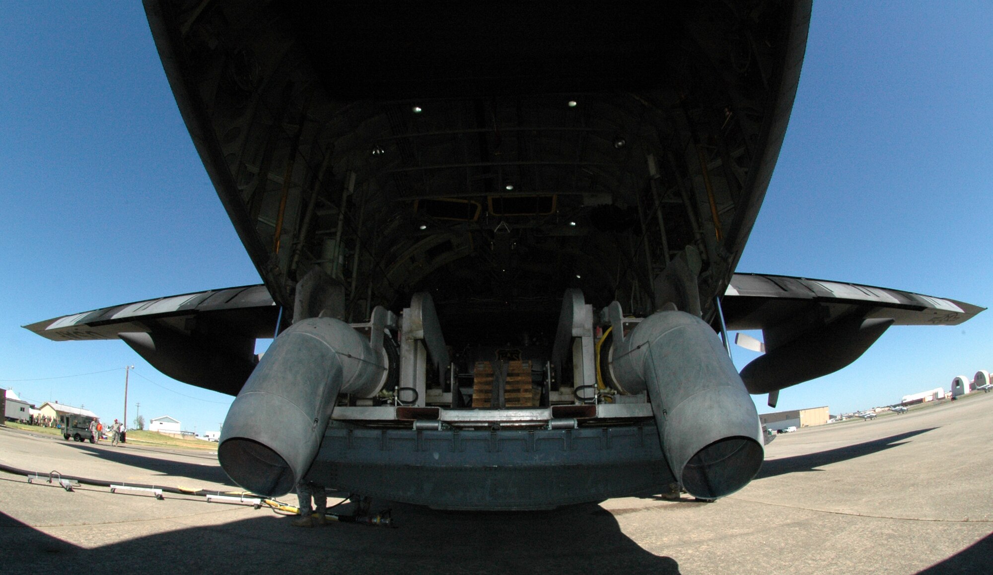 A 153rd Airlift Wing C-130 prepares to be reloaded with pressurized water April 28 during the 2010 Modular Airborne Firefighting System certification training in Greenville, S.C. The annually-held certification brought together more than 400 Air National Guard and Air Force Reserve Airmen and their unit's C-130s to receive certification from the U.S. Forest Service in aerial firefighting. The certification runs April 25-May 1. The 153rd AW is assigned to the Wyoming Air National Guard. (U.S. Air Force photo/Staff Sgt. Stephen J. Collier) 
