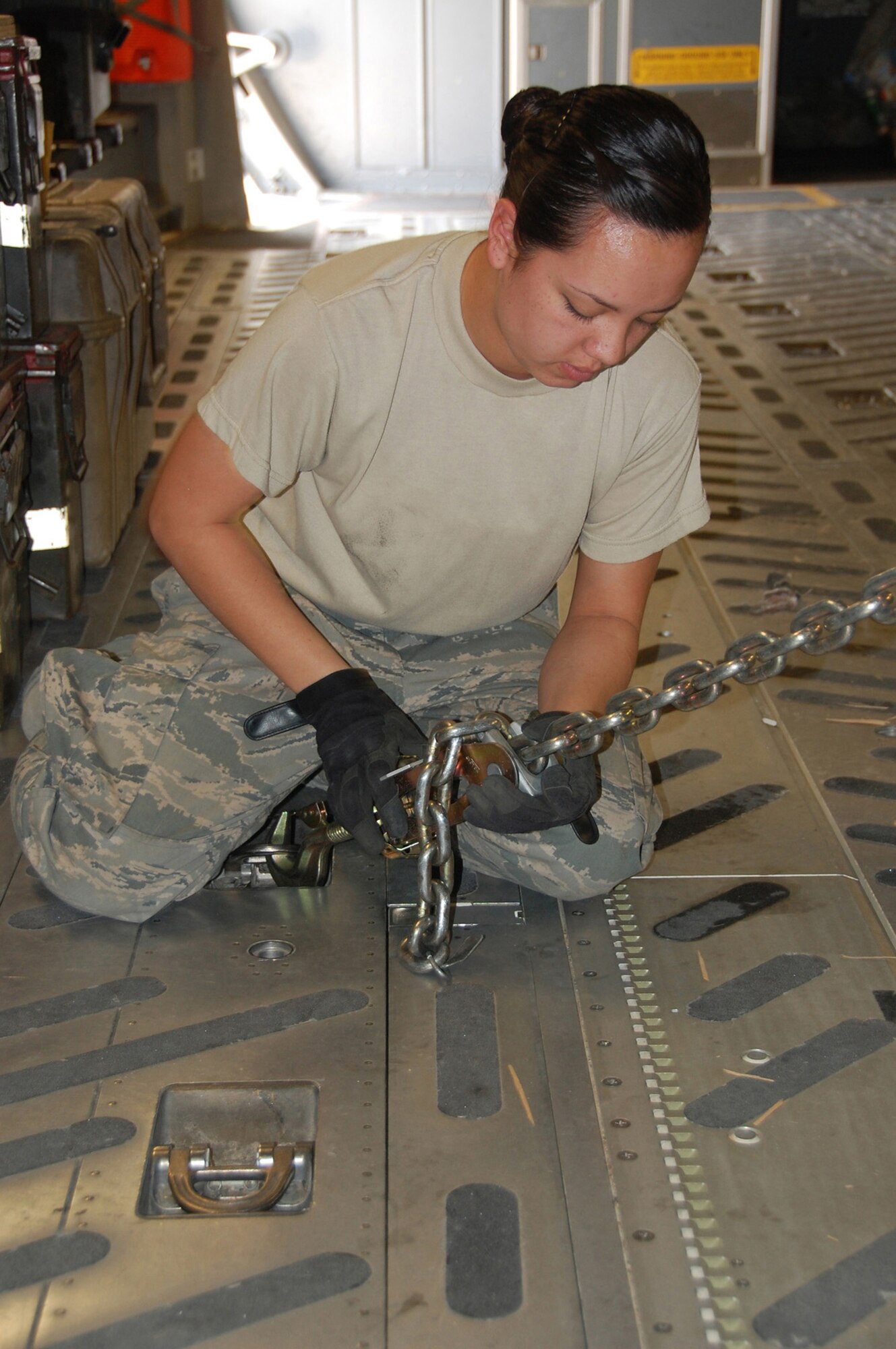 Senior Airman Danielle Bolia, 386th Expeditionary Logistics Readiness Squadron Aerial Port, secures a piece of rolling stock April 27 in Southwest Asia. The Airman is a deployed reservist out of the 71st Aerial Port Squadron, Langley Air Force Base, Va. The 71st APS is a geographically separated unit of the 512th Airlift Wing located at Dover Air Force Base, Del. (U.S. Air Force photo/Tech. Sgt. Lindsey Maurice)