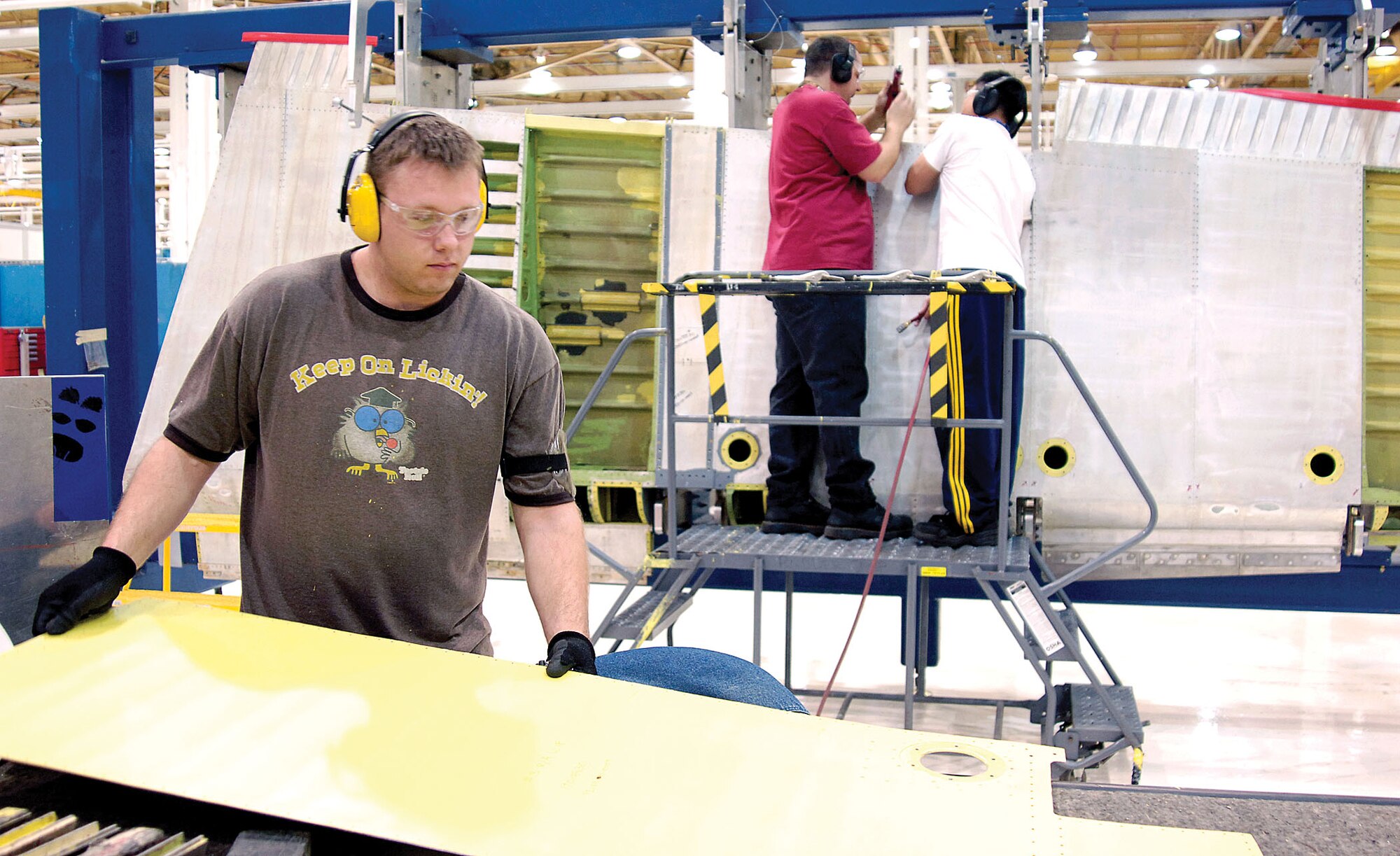 An increased workload at the Oklahoma City Air Logistics Center lead officials to take a look at streamling the hiring process for “outside” employees, those not already in some sort of government service. The new hires are populating all areas of Tinker, including the new shops moving into Bldg. 9001, pictured above. (Air Force photo by Margo Wright)