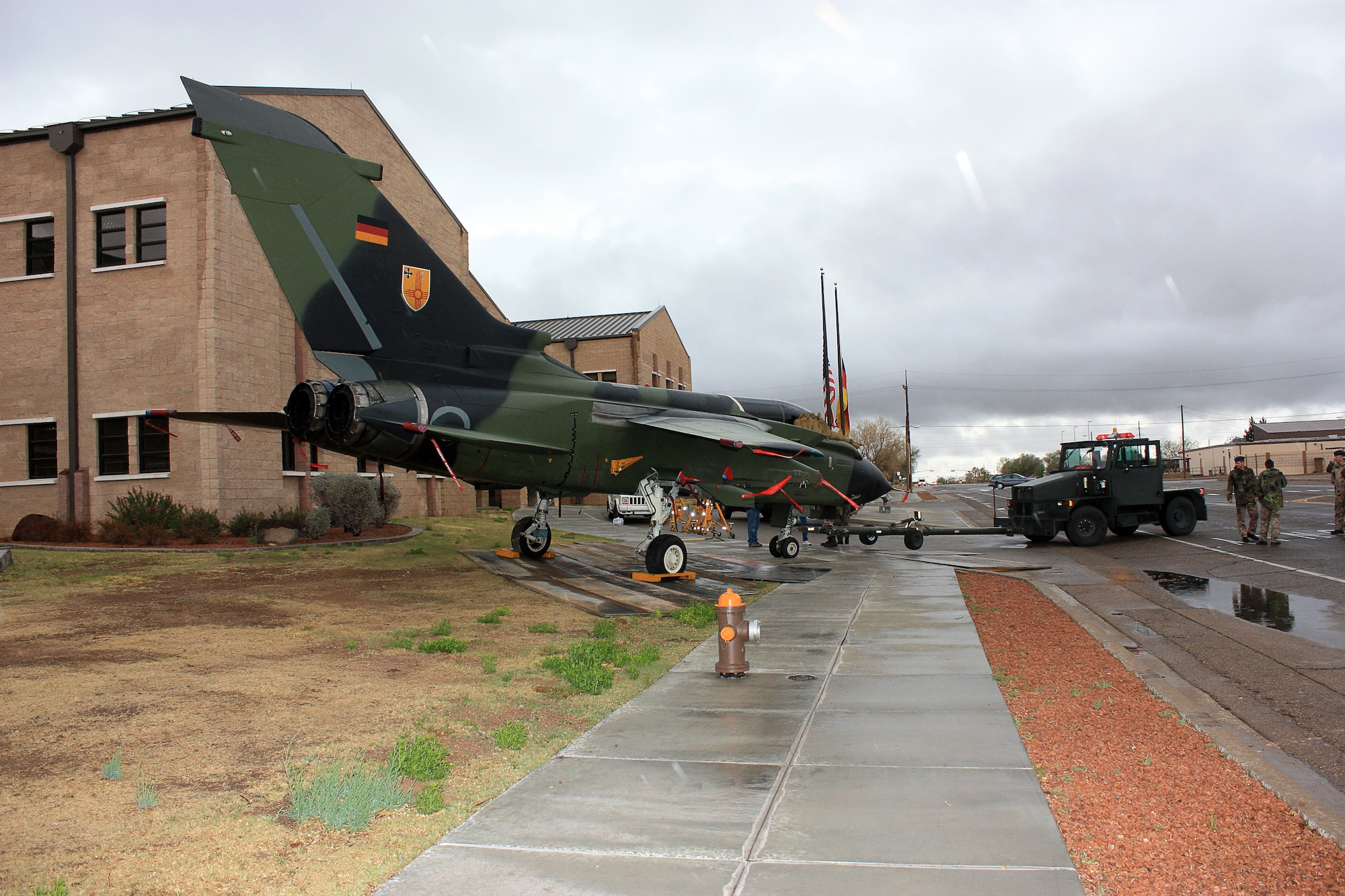 HOLLOMAN AIR FORCE BASE, N.M. -- Members of the German air force push Tornado 45+11 back into its final resting place April 17, 2009, beside the GAF Flying Training Center Headquarters Building. The aircraft was officially unveiled by Col. Frank Kiesel, German Air Force Flying Training Center commander, April 28, 2010. (German Air Force photo by Hauptgefreiter -- Airman 1st Class -- Ihno Boekhoff / Released)