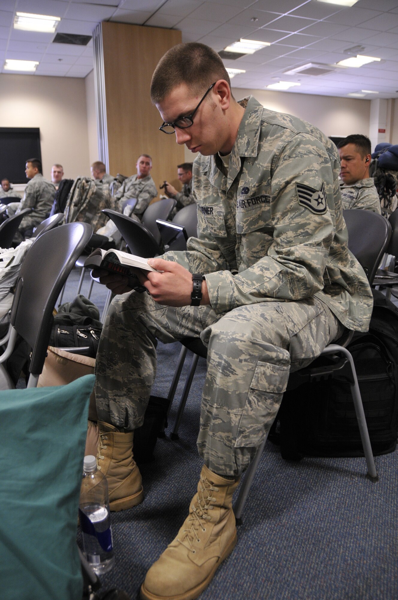 Staff Sgt. Richard Garner, 48th Munitions Squadron Munitions Systems journeyman, relaxes while he waits to board his flight to Bagram Air Field, Afghanistan, in support of Operation Enduring Freedom. Sergeant Garner is one of more than 400 Liberty Warriors deploying from RAF Lakenheath, England, to support OEF. (U.S. Air Force photo Airman 1st Class Eboni Knox) 