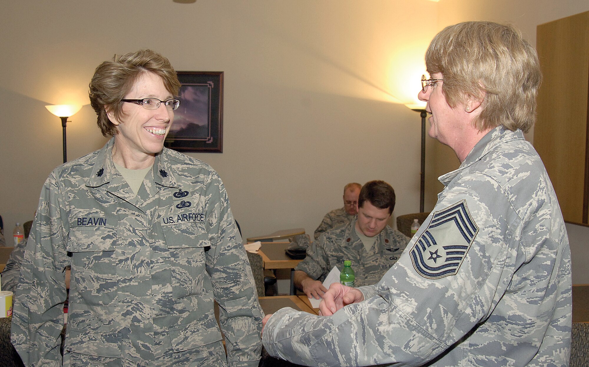 Lt. Col. Angela Beavin, left, and Chief Master Sgt. Terrie Munsey visit during a break at the IMA All-Hands Conference held at Tinker April 21-23. Updates on base services and Tinker’s mission filled the agenda for the two-day event. Both IMAs are with the 72nd ABW Plans and Programs. (Air Force photo by Margo Wright)