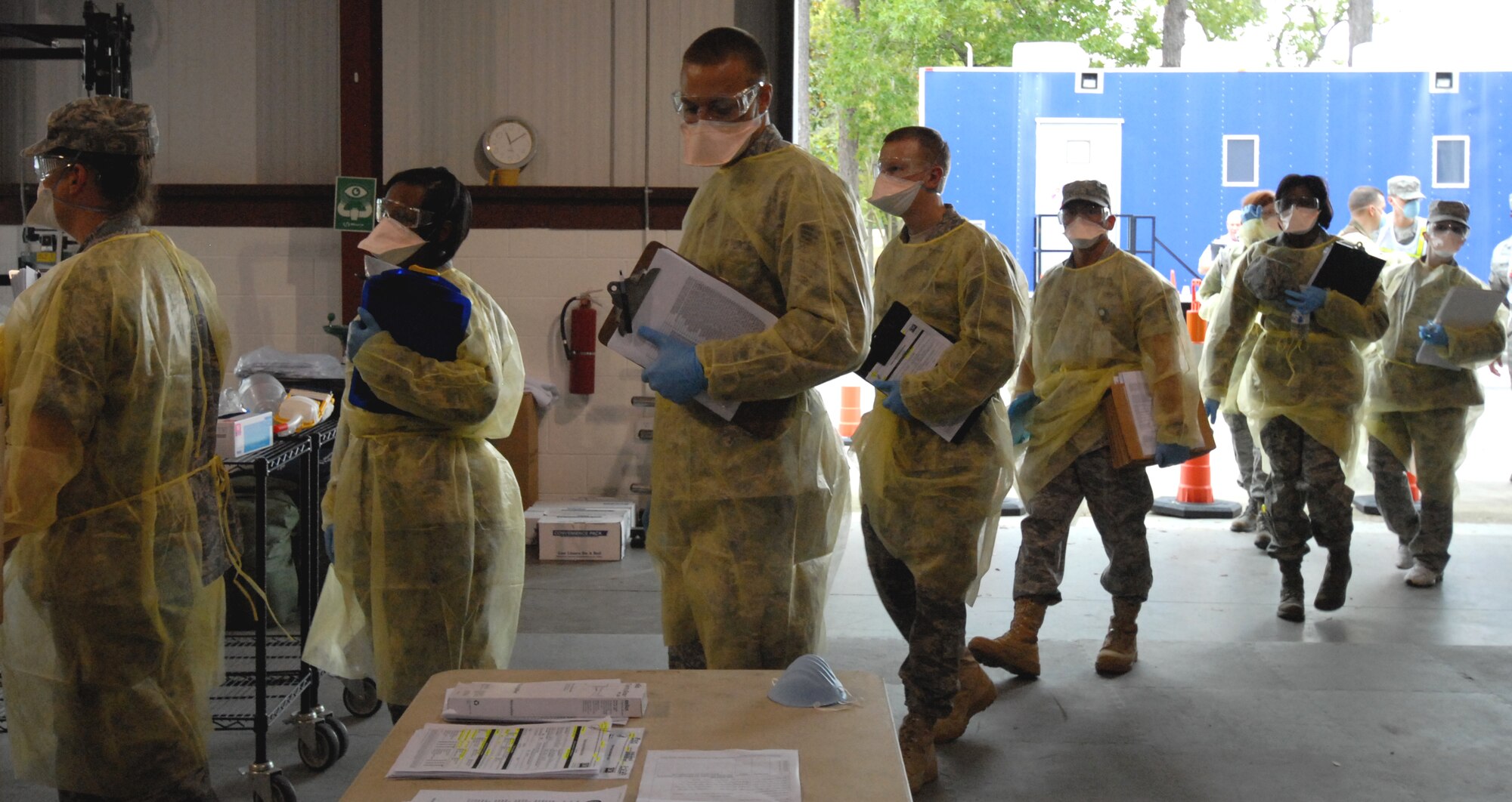 EGLIN AIR FORCE BASE, Fla. – Airmen with the 96th Medical Group enters the triage site to begin diagnosing patients at the Eglin hospital during an exercise April 27. The exercise simulated a naturally occurring outbreak of disease involving pneumonic plague. As a result, the base hospital became the main triage site where medical personnel diagnosed the potentially infected. Patients identified as infected were isolated to prevent further spread of the pandemic and for additional surveillance. These exercises are conducted at Eglin to maintain constant mission and emergency readiness. (U.S. Air Force photo/ Airman 1st Class Anthony Jennings)