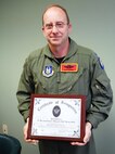 Lt. Col. Lewis Harding, 940th Wing Chief of Safety, displays the 2009 Eighth Air Force Safety Program of the Year Award, presented jointly to the 940th and the 9th Reconnaissance Wings at Beale Air Force Base, Calif. Lauded as Air Force Reserve Command's number one ongoing Total Force Initiative, the 940th Wing's zero mishap rate also earned the AFRC Chief of Safety Outstanding Acievement Award for Flight Safety.   