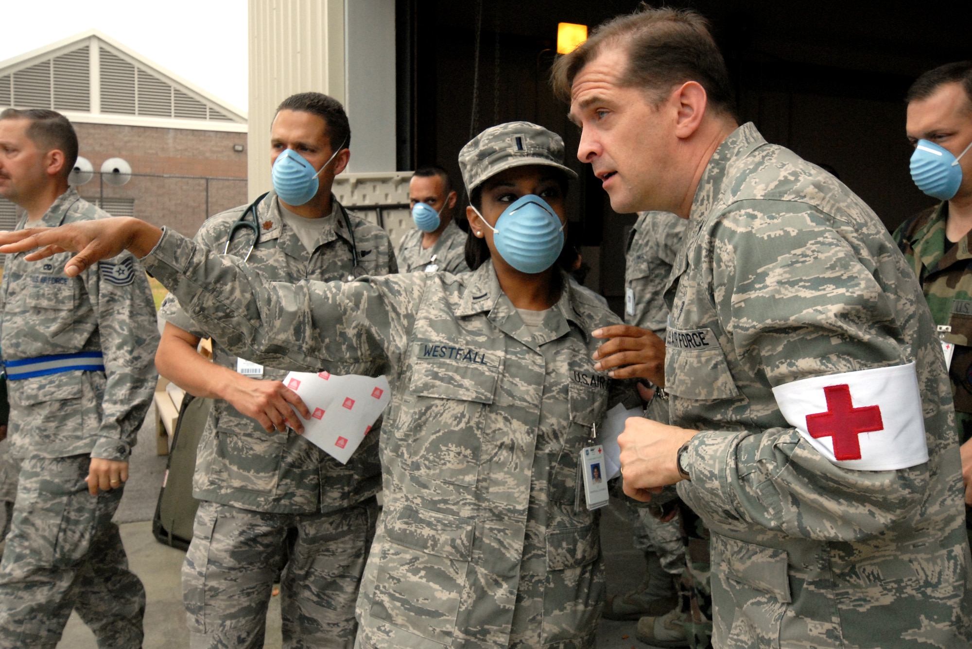 EGLIN AIR FORCE BASE, Fla. – 1st Lt. Latasha Westfall, 96th Medical Operations Squadron, discusses triage set up plans with Lt. Col. James Scott, 96th MDOS, during an exercise April 27. The exercise simulated a naturally occurring outbreak of disease involving pneumonic plague. As a result, the base hospital became the main triage site where medical personnel diagnosed the potentially infected. Patients identified as infected were isolated to prevent further spread of the pandemic and for additional surveillance. These exercises are conducted at Eglin to maintain constant mission and emergency readiness. (U.S. Air Force photo/ Airman 1st Class Anthony Jennings)