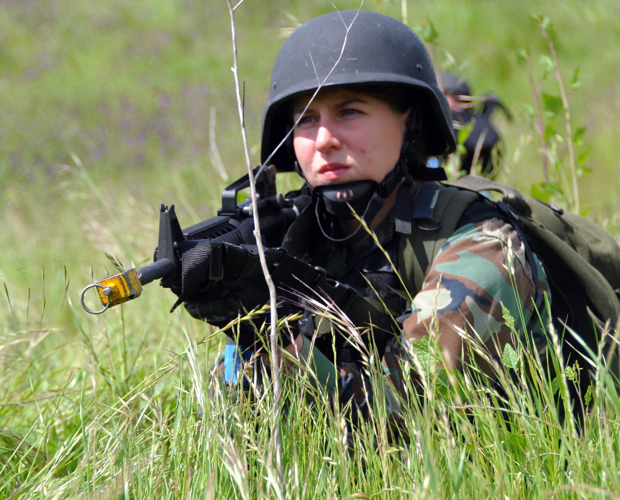 Navy Master of Arms Laura Ortlip holds her prone firing position while awaiting enemy fire during a weeklong exercise at Camp Park Reserve Force Training Area in Dublin, Calif. (U.S. Air Force photo/Airman 1st Class Michael Battles)
