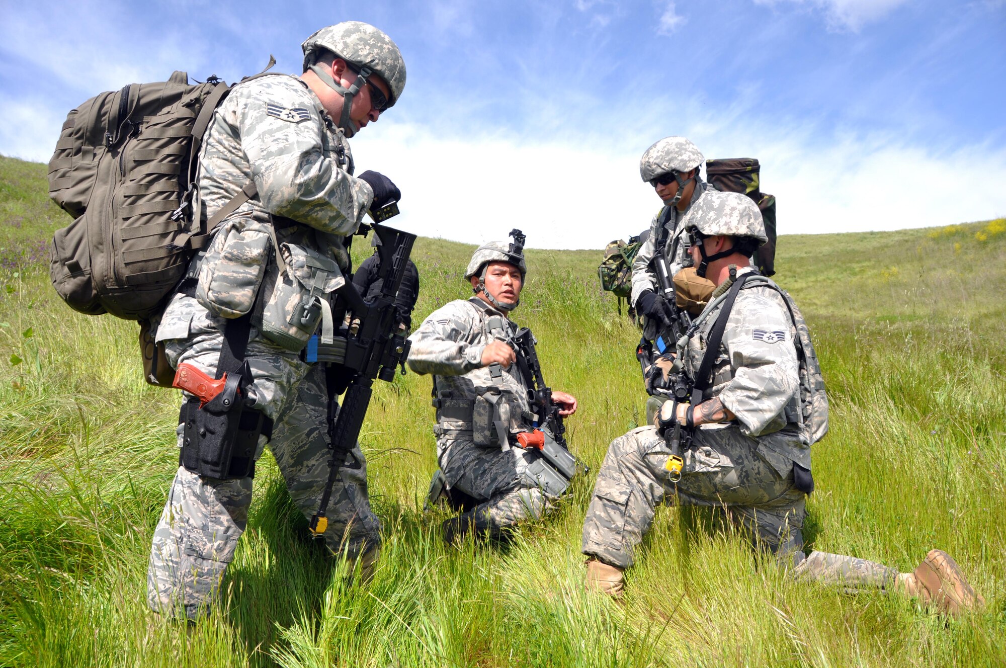 Tech. Sgt. Dwight Valeros, 60th Security Forces Squadron flight chief, briefs the other Airmen on their mission objectives during an exercise at Camp Park Reserve Force Training Area in Dublin, Calif. (U.S. Air Force photo/Airman 1st Class Michael Battles)
