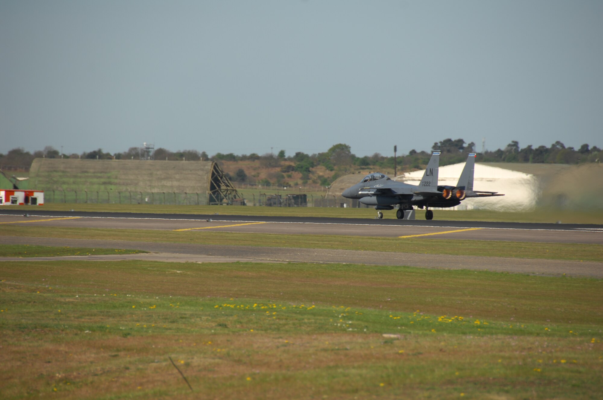An F15-E aircraft from the 492nd Fighter Squadron, RAF Lakenheath, England, take off for normal flying operations here April 26. Over the next few weeks, various aircraft will temporarily relocate to RAF Mildenhall, England, in preparation for the airfield closure at RAF Lakenheath. The relocation is due to construction on the runway and adjoining taxiways at RAF Lakenheath that will take approximately one month to complete. (U.S. Air Force photo/Tech. Sgt. Christopher Campbell)