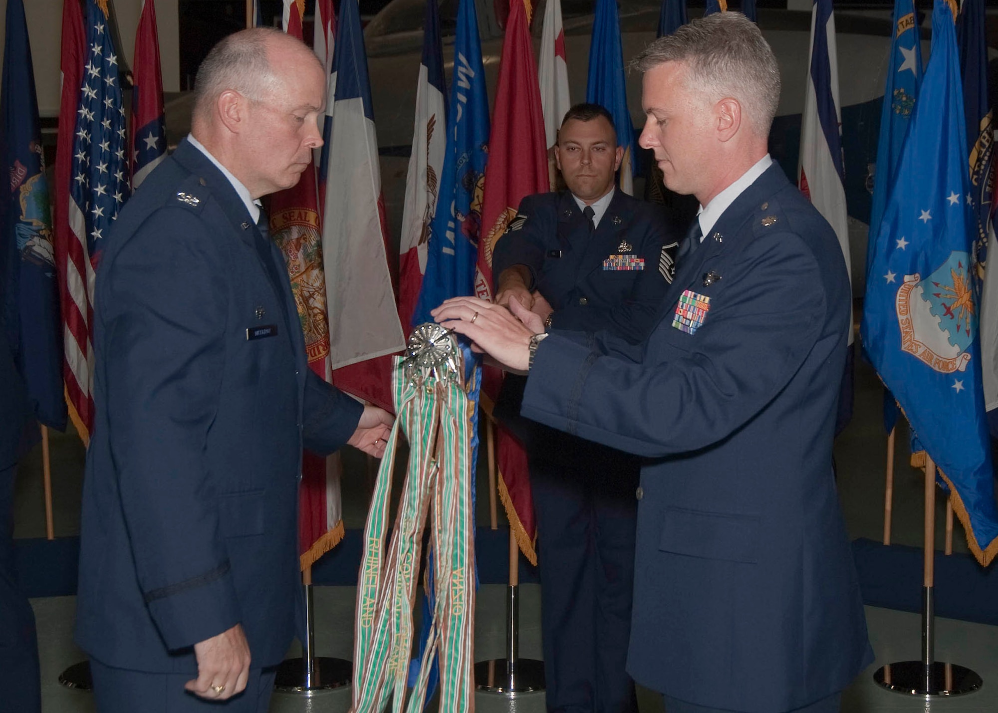 Col. Kevin McElroy, 53rd Electronic Warfare Group commander, and new commander of the 513th Electronic Warfare Squadron, Lt. Col. Tim Welde, unfurl the squadron flag at the activation ceremony April 23 at Eglin Air Force Base Fla.  The squadron serves as the sole Department of Defense provider of electronic warfare support for the F-35 Joint Strike Fighter.  The squadron, currently manned by 32 technicians and engineers, will grow to 130 personnel at full strength. The squadron will operate the $300 million United States Reprogramming Laboratory, which tests all aspects of the Joint Strike Fighter's electronic warfare capability. Fifty percent of the total personnel will be Airmen, while the other half will consist of Navy and Marine personnel. (Courtesy photo) 
