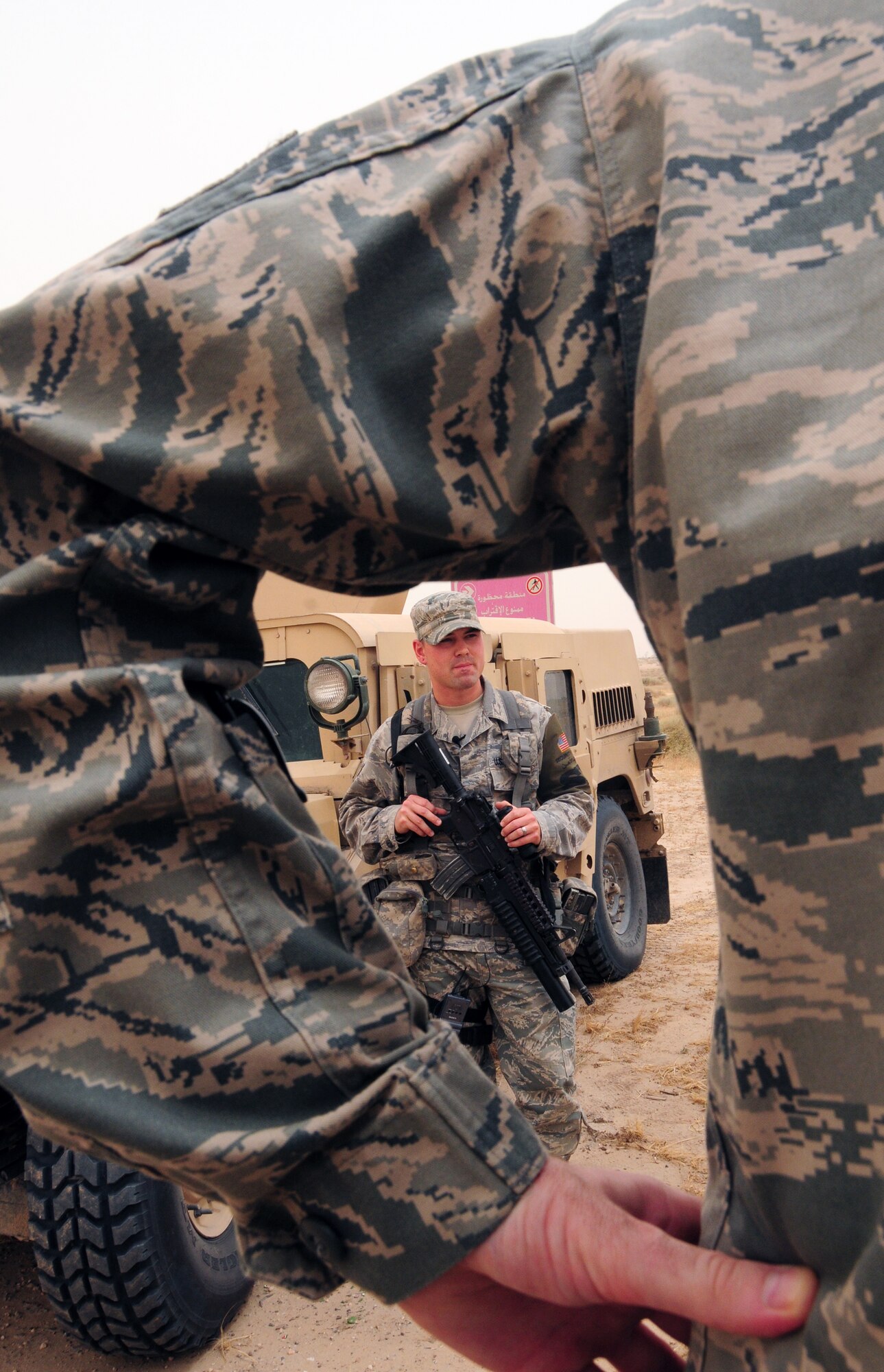 U.S. Air Force Senior Airman Stephen Fargher, 387th Expeditionary Security Forces Squadron response force leader, prepares to go on a mobile patrol of the perimeter of an undisclosed air base in Southwest Asia April 23, 2010. (U.S. Air Force photo by Staff Sgt. Lakisha A. Croley/Released)