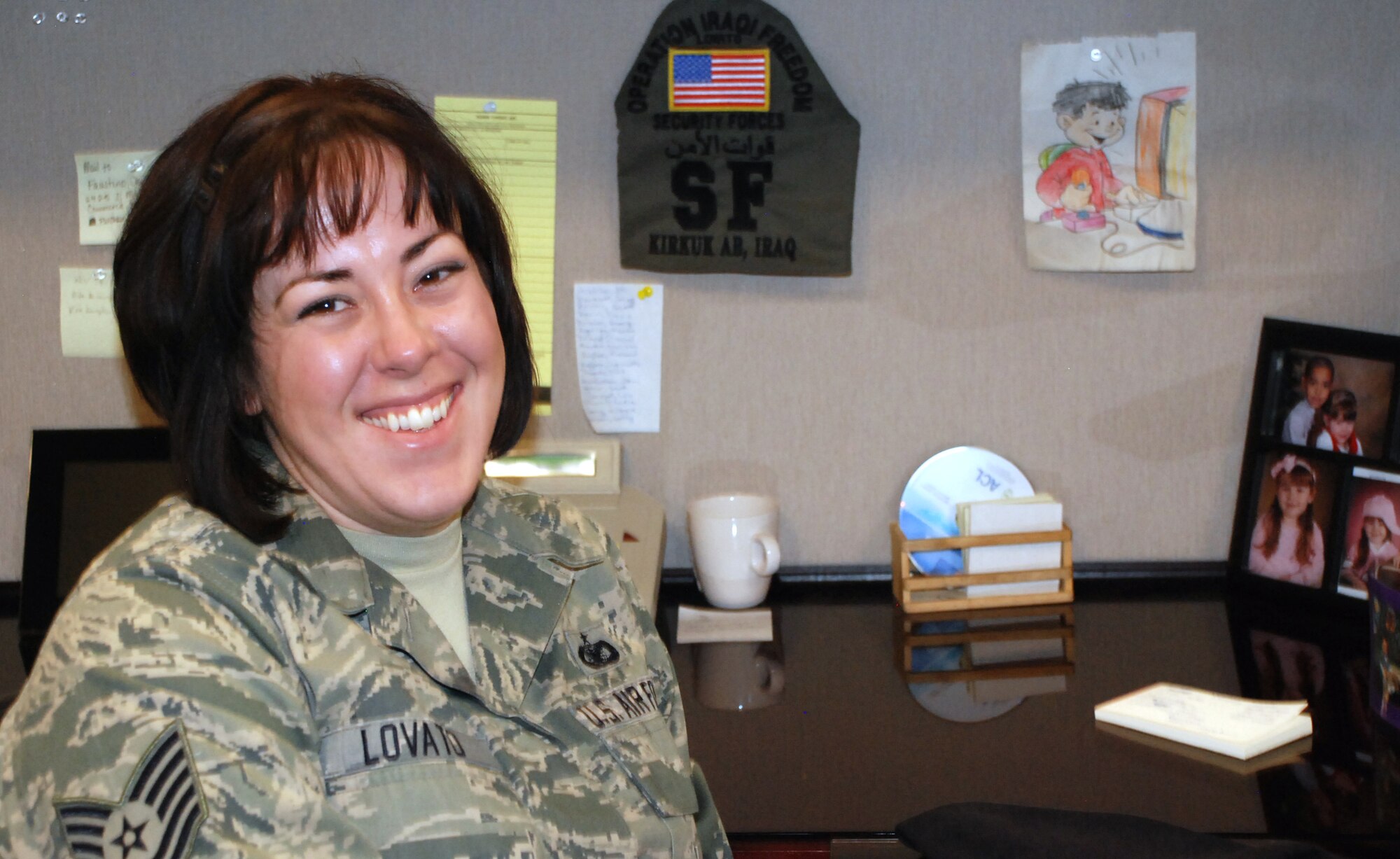 Tech. Sgt. Crystal Lovato keeps memoires of her time in Iraq at her desk, where she works as a Dean of Faculty staff support NCO. She has been invited to participate in the upcoming Warrior Games in Colorado Springs sponsored by the U.S. Olympic Committee?s Paralympic Military Program. (U.S. Air Force photo/Ann Patton)