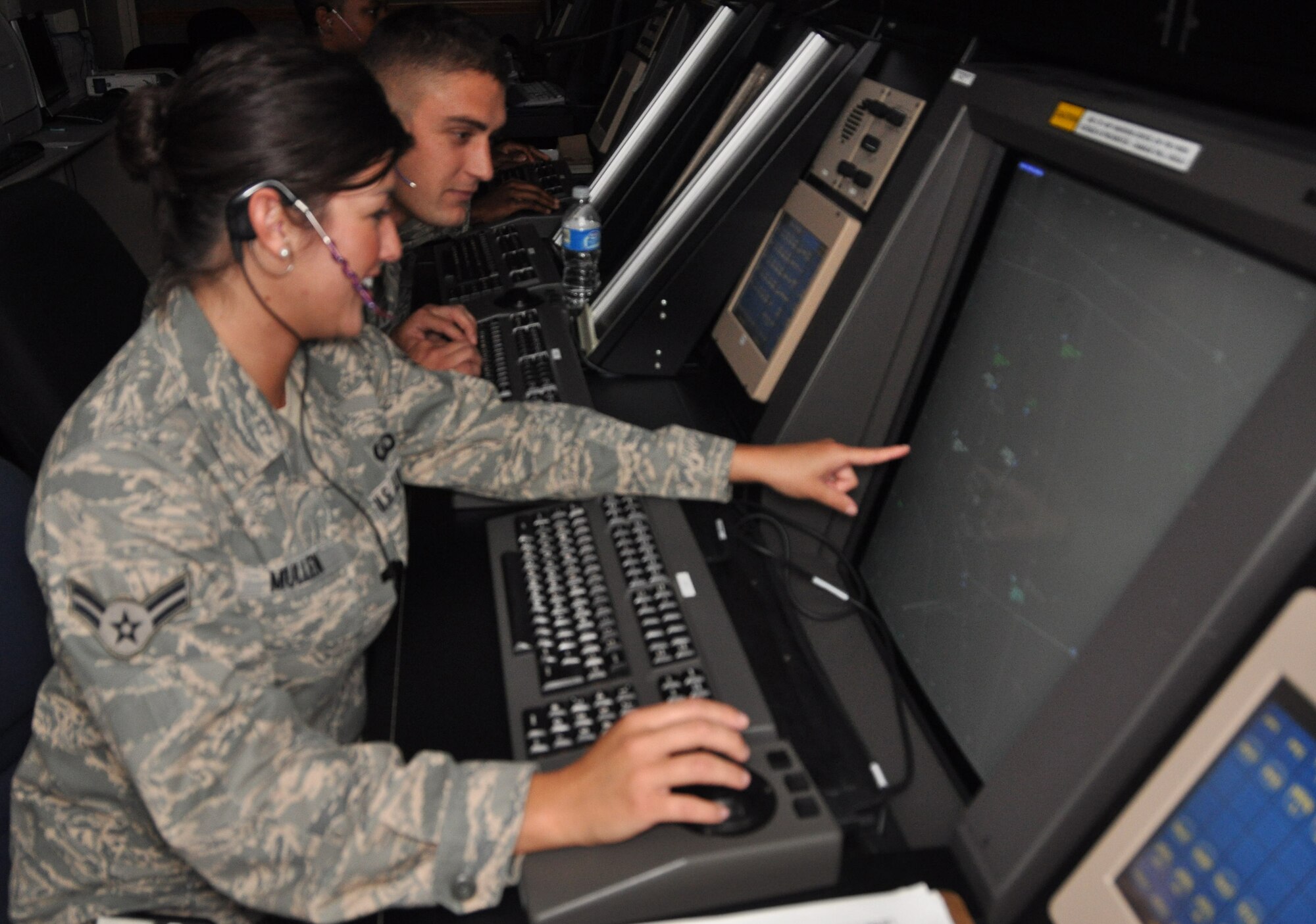 Airman 1st Class Evangelina Mullen and Airman 1st Class Jake Wagner, 325th Operations Support Squadron air traffic controllers, train on radar simulators in preparation for the opening of the new Northwest Florida Beaches International Airport and increased air traffic. (U.S. Air Force photo by Airman 1st Class Rachelle Elsea)