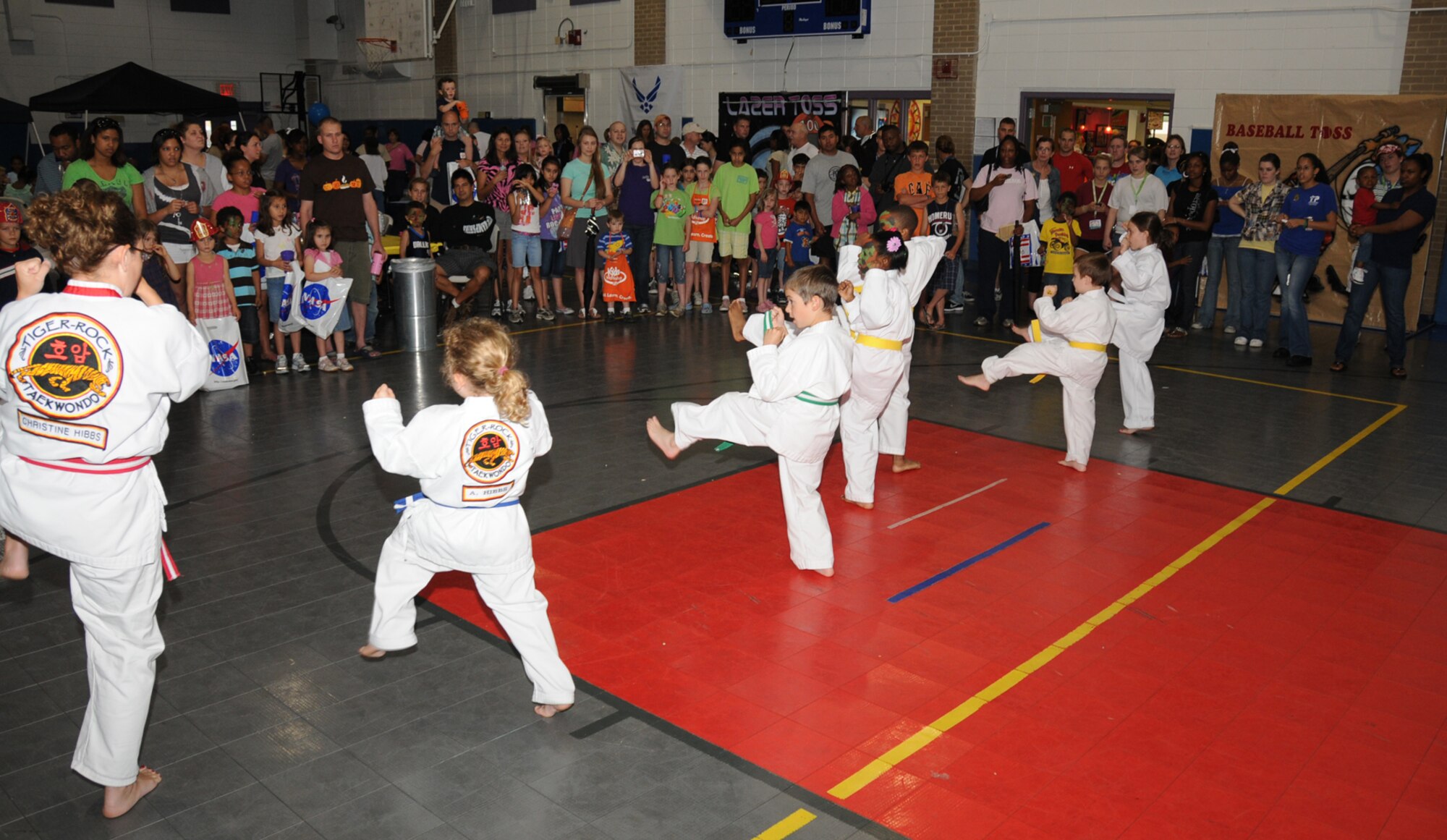 Youth center taekwondo students of Joe Calhoun provide a martial arts demonstration during Child Pride Day, April 24 at the youth center.  (U.S. Air Force photo by Kemberly Groue)