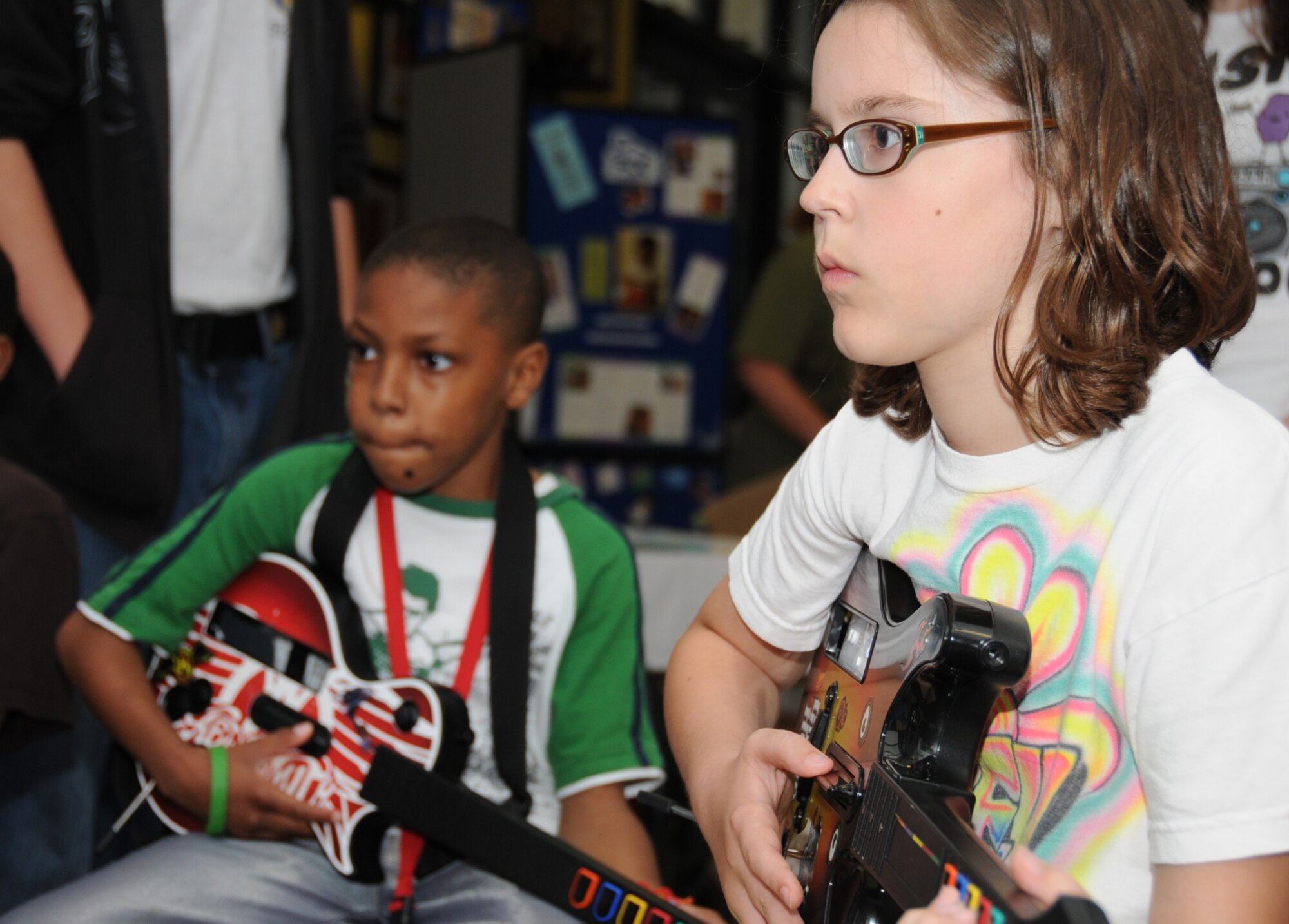 Quentin Thomas, 9, and Riley Hamant, 10, battle on Guitar Hero to “Eye of the Tiger.”  Quentin’s parents are Courtney Thomas, child development center, and retiree Anthony Thomas.  Riley is the daughter of Lt. Col. Brad and Vicki Hamant, 332nd Training Squadron. (U.S. Air Force photo by Kemberly Groue)