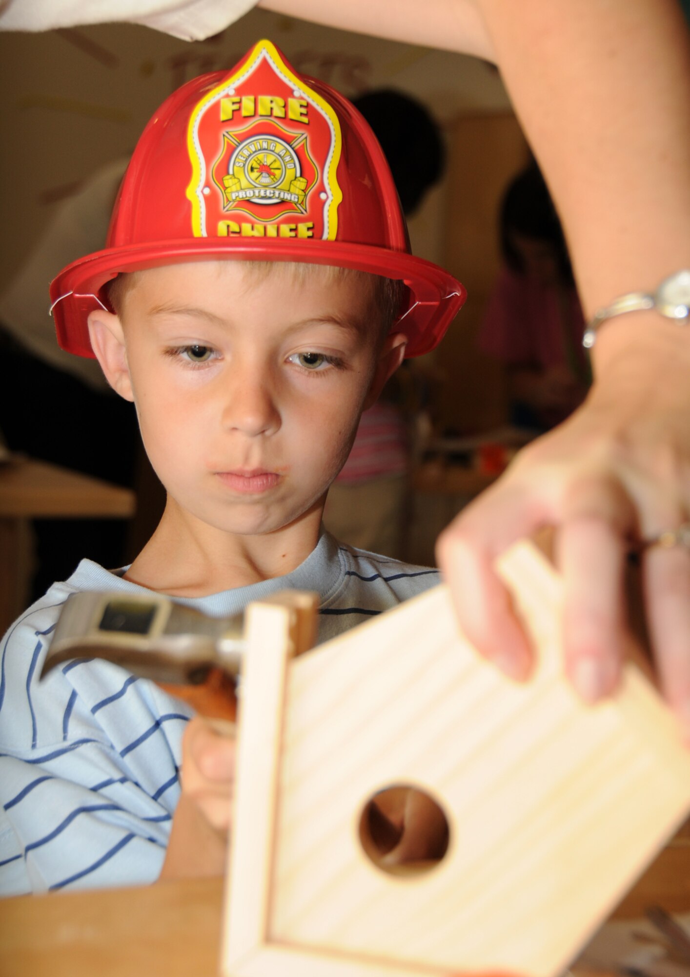 Six-year-old Adam Cimenski, works on a bird house.  Adam’s parents are Senior Master Sgts. Erin Cimenski, 81st MSGS, and Thomas Cimenski, 338th TRS.  (U.S. Air Force photo by Kemberly Groue)