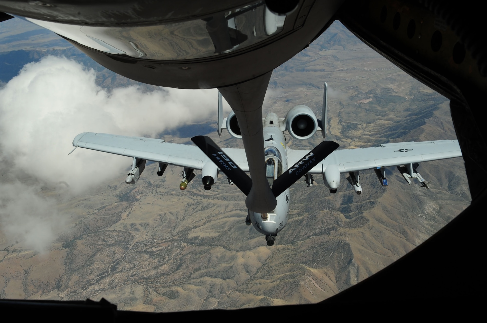 A KC-135 Stratotanker from the 117th Air Refueling Squadron, based out of Forbes Field, Kan., refuels an A-10C Thunderbolt II from the 355th Fighter Wing in the Tombstone Military Operating Area in Southern Arizona April 27. The crew and KC-135 supported refueling missions throughout the week so students enrolled in the A-10C Pilot Initial Qualification course could accomplish their first-ever air-to-air refueling. (U.S. Air Force photo/Airman Jerilyn Quintanilla) 