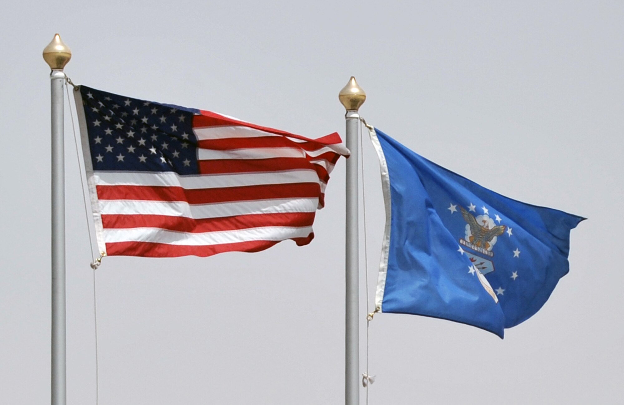 The American flag and the U.S. Air Force flag flies over the Sept. 11, 2001, memorial on the compound of the 380th Air Expeditionary Wing at a non-disclosed base in Southwest Asia on April 27, 2010. (U.S. Air Force Photo/Master Sgt. Scott T. Sturkol/Released)