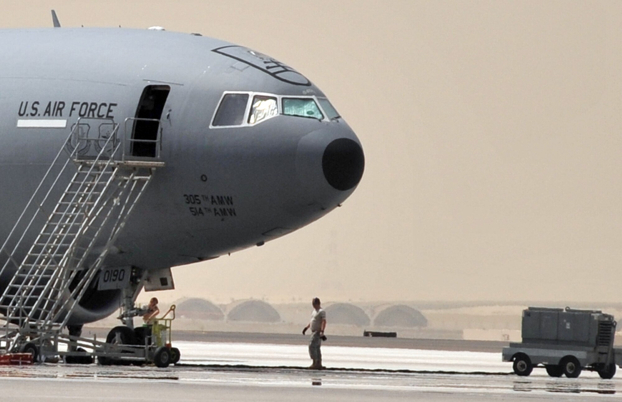 Maintenance Airmen from the 380th Expeditionary Aircraft Maintenance Squadron Extender aircraft maintenance unit work on a KC-10 Extender during maintenance operations for the 380th Air Expeditionary Wing at a non-disclosed base in Southwest Asia on April 27, 2010. KC-10s and the maintenance Airmen who support them deployed to the 380th AEW are a part of the 908th Expeditionary Air Refueling Squadron and are deployed from Joint Base McGuire-Dix-Lakehurst, N.J., and Travis Air Force Base, Calif. (U.S. Air Force Photo/Master Sgt. Scott T. Sturkol/Released)