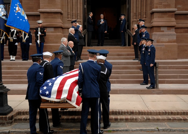 Honorary pallbearers salute U.S. Air Force Brig. Gen. Thomas R. Mikolajcik as members from Joint Base Charleston Honor Guard march up the steps into the church for the funeral April 24, 2010, at the Cathedral of St. John the Baptist in Charleston, S.C. General Mikolajcik passed away April 17, 2010 at the age of 63 after battling amyotrophic lateral sclerosis, commonly referred to as Lou Gehrig's disease. (U.S. Air Force photo/Senior Airman Timothy Taylor)