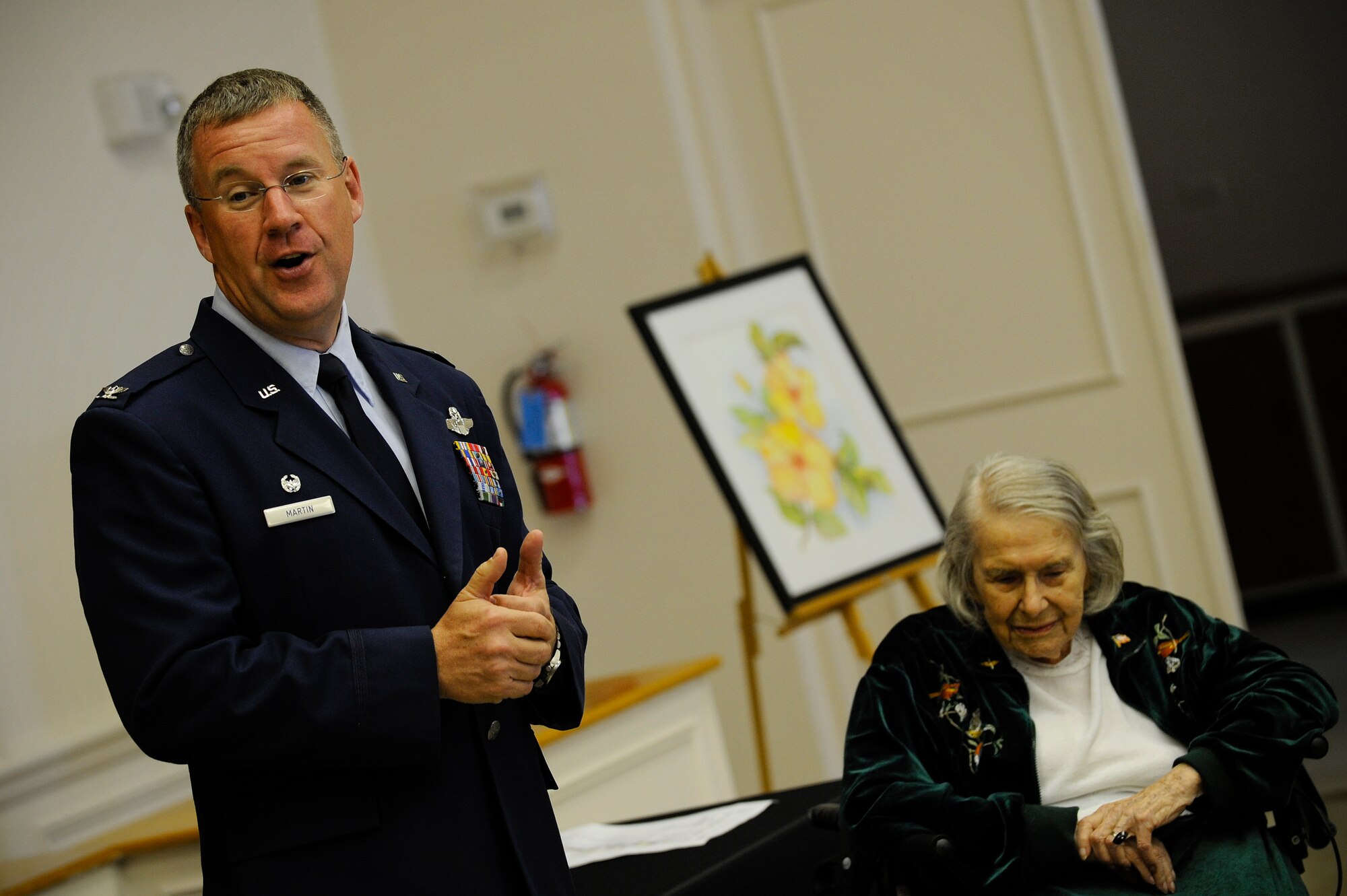 Col. Larry Martin, 6 Air Mobility Wing commander, gives a speech as Dorothy Ebersbach, Women Airforce Service Piliots (WASP) pilot, looks on during her Congressional Gold Medal ceremony in Tampa, Fla., April 28, 2010. The Congressional Gold Medal is the highest and most distinguished award Congress can award to a civilian. The WASP program was established during World War II, and from 1942 to 1943, more than 1,000 women joined, flying 60 million miles of noncombat military missions.
(U.S. Air Force photo by Staff Sgt. Joseph L. Swafford Jr.)