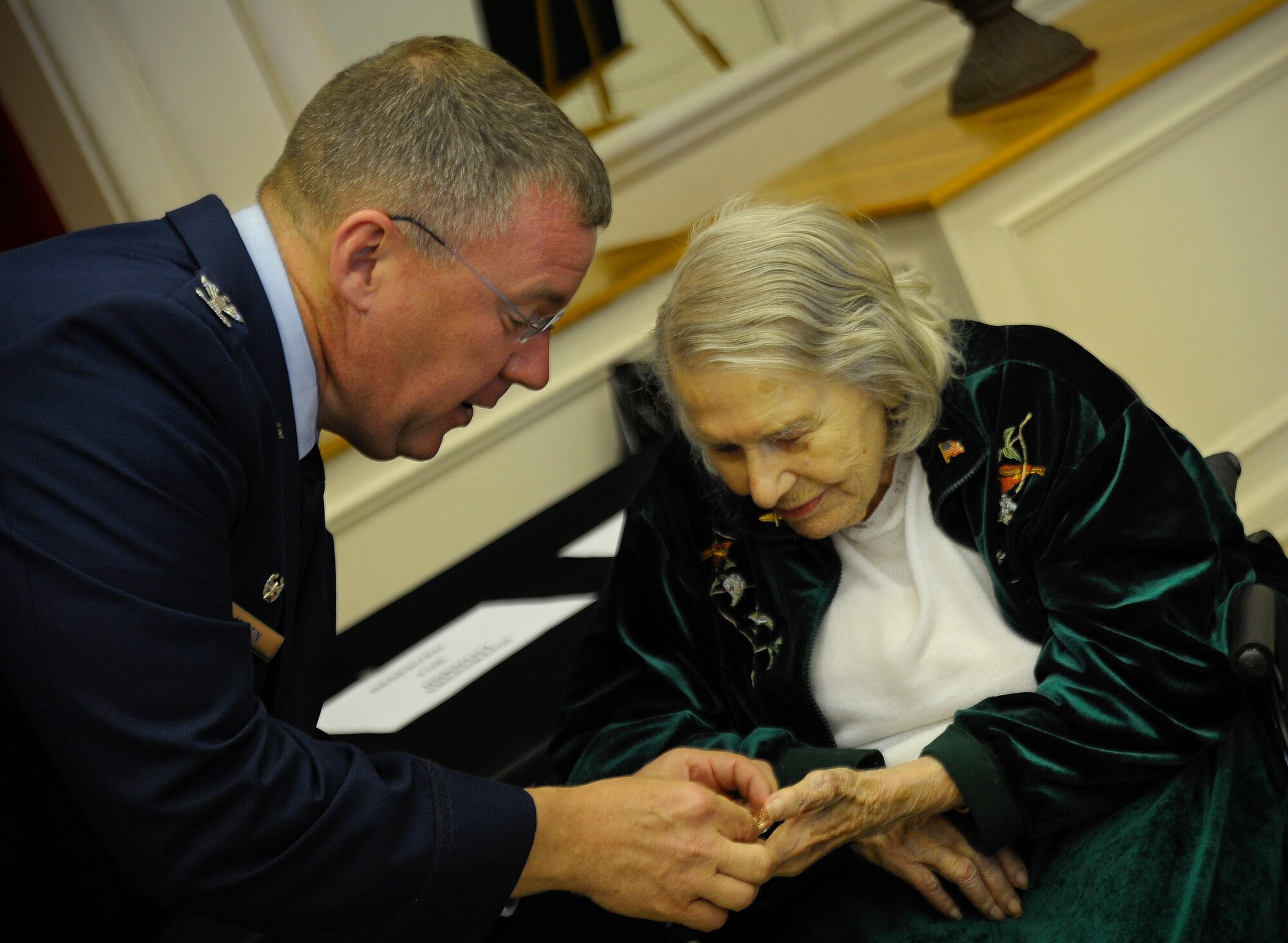 Col. Larry Martin, 6 Air Mobility Wing commander, presents Dorothy Ebersbach, Women Airforce Service Piliots (WASP) pilot, her Congressional Gold Medal Coin during a Medal ceremony in Tampa, Fla., April 28, 2010. The Congressional Gold Medal is the highest and most distinguished award Congress can award to a civilian. The WASP program was established during World War II, and from 1942 to 1943, more than 1,000 women joined, flying 60 million miles of noncombat military missions.
(U.S. Air Force photo by Staff Sgt. Joseph L. Swafford Jr.)