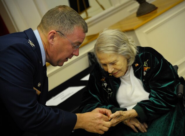Col. Larry Martin, 6 Air Mobility Wing commander, presents Dorothy Ebersbach, Women Airforce Service Piliots (WASP) pilot, her Congressional Gold Medal Coin during a Medal ceremony in Tampa, Fla., April 28, 2010. The Congressional Gold Medal is the highest and most distinguished award Congress can award to a civilian. The WASP program was established during World War II, and from 1942 to 1943, more than 1,000 women joined, flying 60 million miles of noncombat military missions.
(U.S. Air Force photo by Staff Sgt. Joseph L. Swafford Jr.)