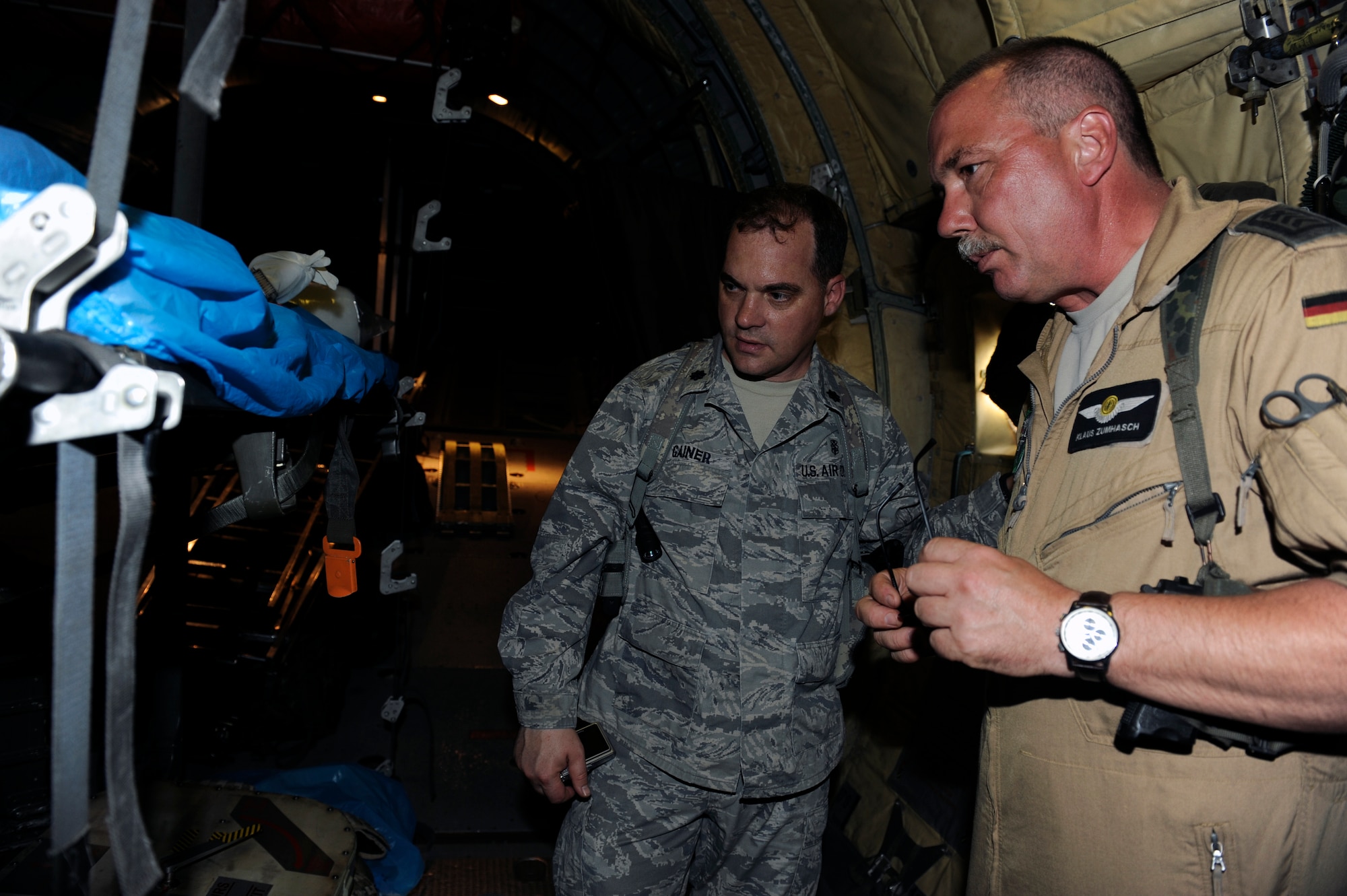 German military Chief Master Sgt Klaus Zuaihasch, a medical crew chief at Camp Marmal, Afghanistan, gives U.S. Air Force Lt. Col. Michael Gainer, commander, 455th Aeromedical Evacuation Flight a tour of a German C-160 aero medical evacuation aircraft, April 25, 2010. Colonel Gainer was visiting Camp Marmal to discuss the aeromedical evacuation mission in anticipation of the surge. (U.S. Air Force photo by/ Tech. Sgt. Jeromy K. Cross/released
