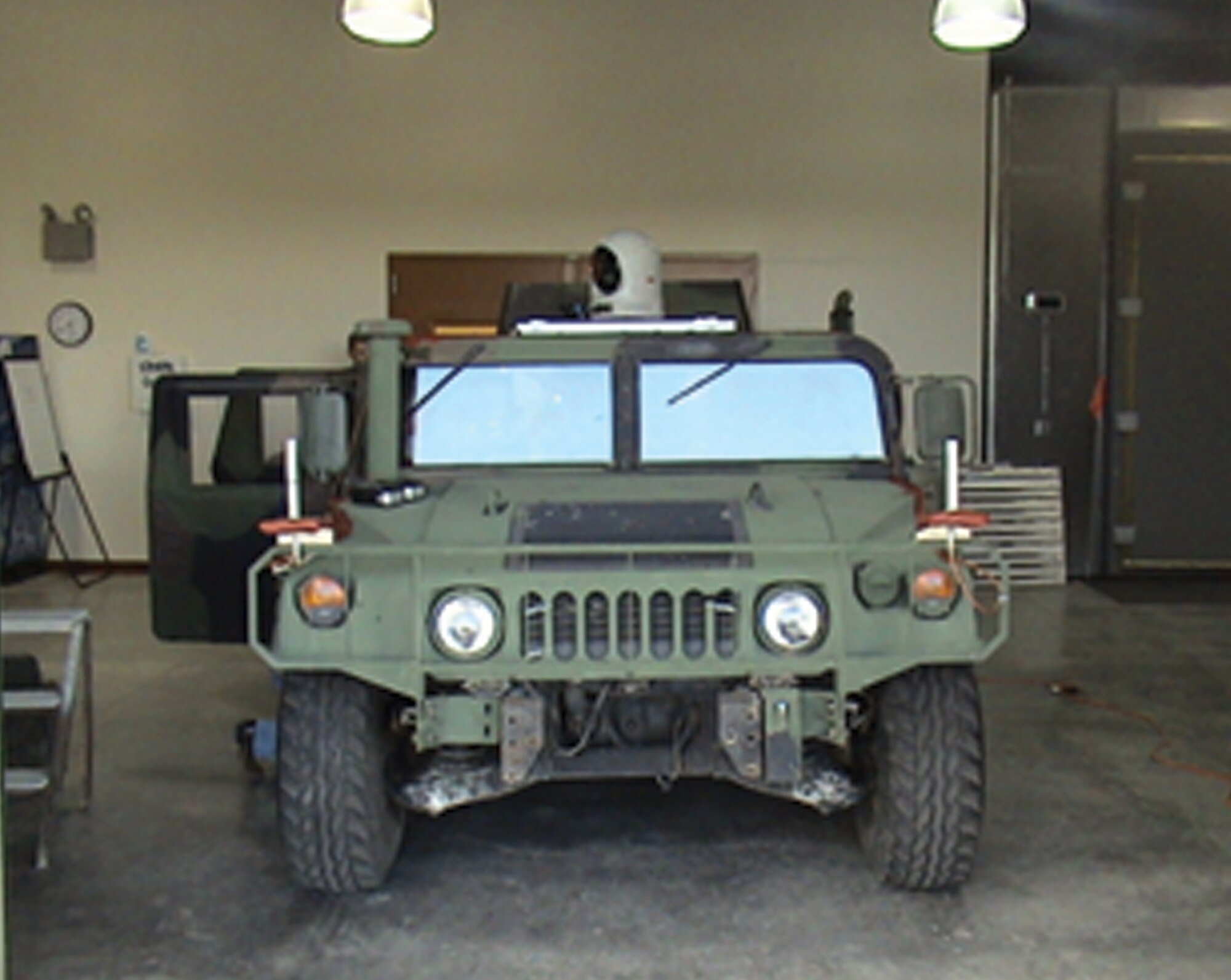 High-mobility multipurpose wheeled vehicle equipped with FALCON, the Fast Airborne Laser Communications Optical Node, for demonstration testing in Albuquerque, New Mexico 
(AFRL image)