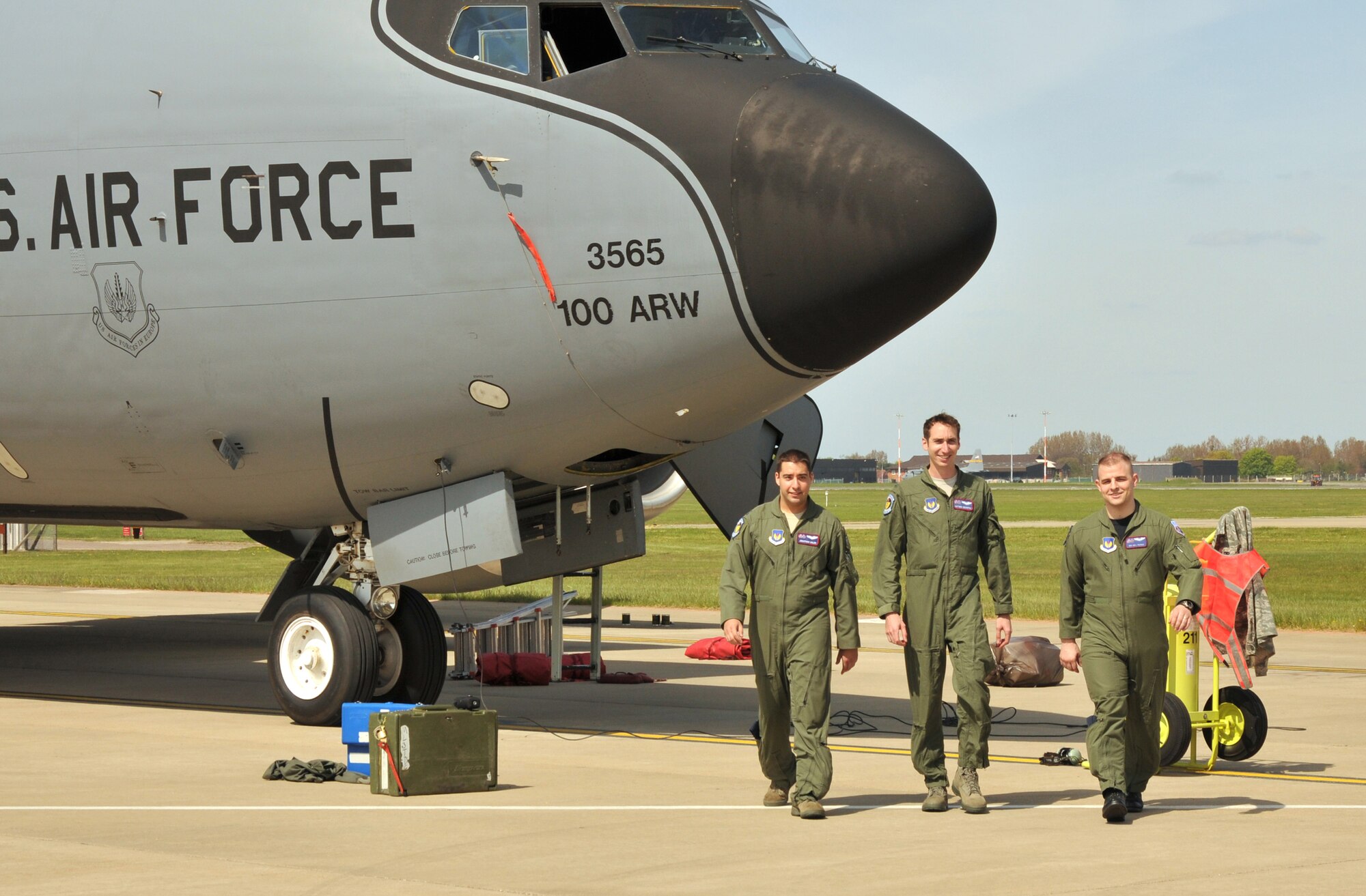 RAF MILDENHALL, England - The 351st Air Refueling Squadron crew of the April 27 Quid 20 mission disembark their aircraft on the RAF Mildenhall flightline. Capt. Jonathan Uhler, aircraft commander, 1st Lt. Matthew Greenspan, pilot, and Senior Airman Neil Patras, boom operator, were all interviewed by a local television crew after the flight. (U.S. Air Force photo/Tech. Sgt. Kevin Wallace)