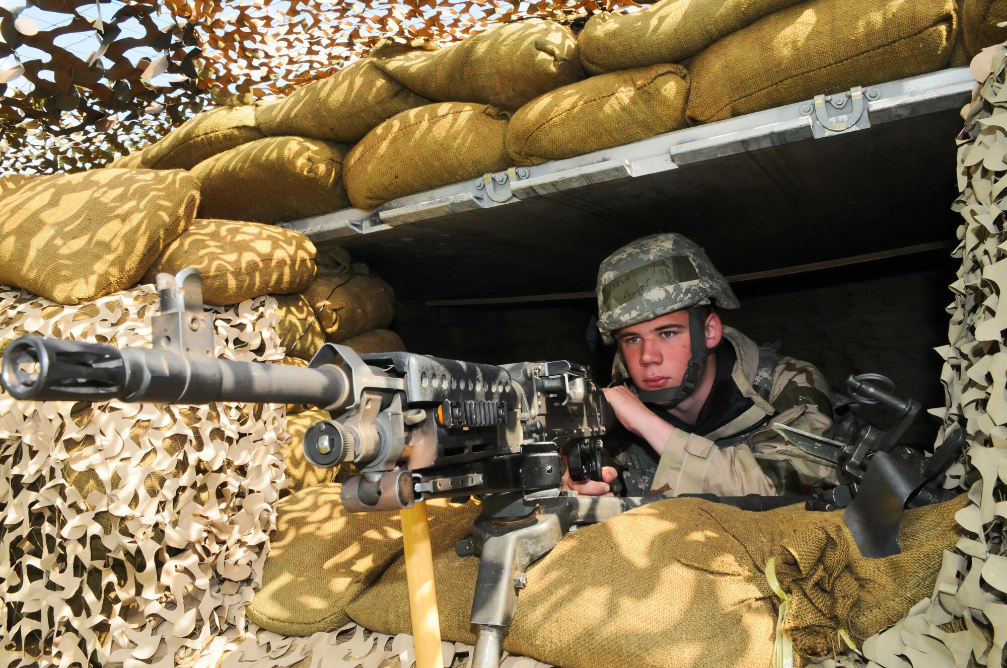 SPANGDAHLEM AIR BASE, Germany – Airman Dana Crovo, 52nd Security Forces Squadron police officer, looks for enemy activity from a defensive fighting position during Operation Saber Crown 10-6 April 27. Members of the 52nd Fighter Wing participated in the Phase II exercise to evaluate the wing’s ability to survive and operate in a chemical, biological, radiological, nuclear and explosive environment. (U.S. Air Force photo/Airman 1st Class Nick Wilson)