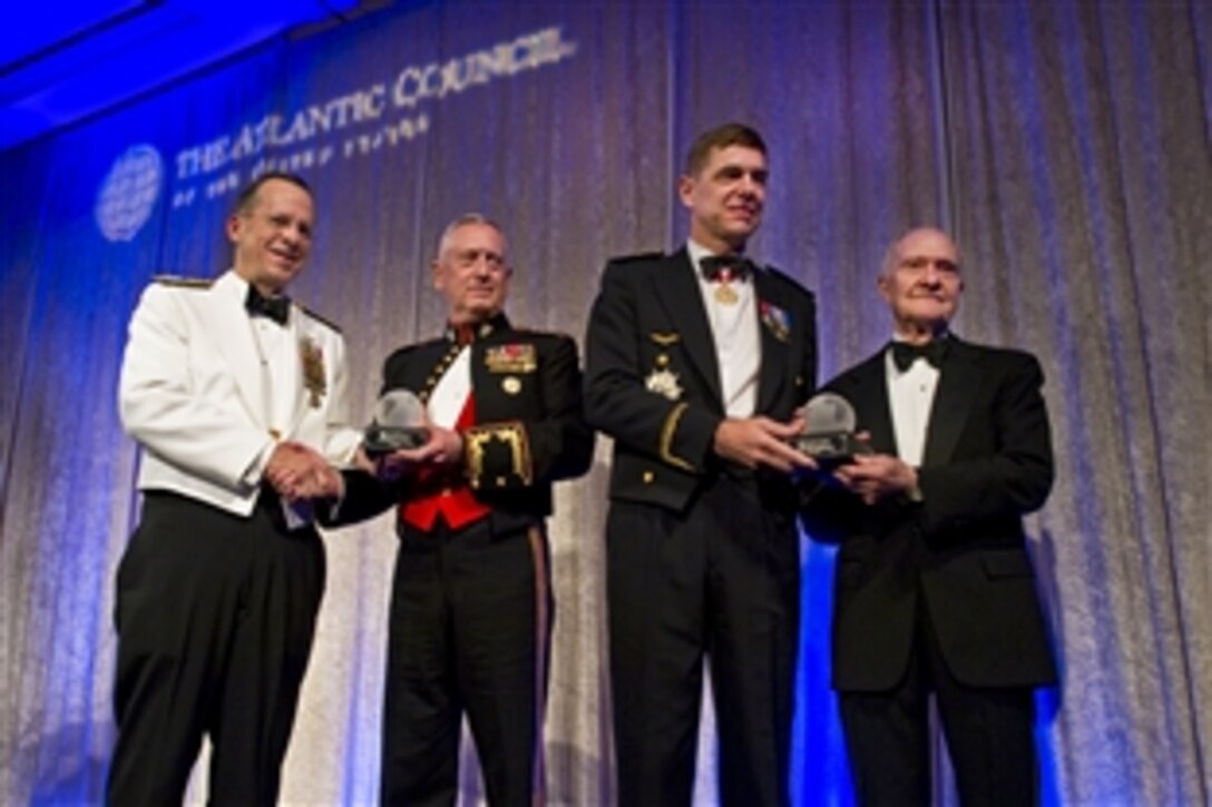 Navy Adm. Mike Mullen, chairman of the Joint Chiefs of Staff, far left and retired Air Force Lt. Gen. Brent Scowcroft, far right, present U.S. Marine Corps Gen. James N. Mattis, commander, U.S. Joint Forces Command, center left, and French Gen. Stephane Abril, NATO Supreme Allied Commander Transformation, with the Distinguished Military Leadership Award at the annual Atlantic Council Awards Gala in Washington, D.C., April 26, 2010.