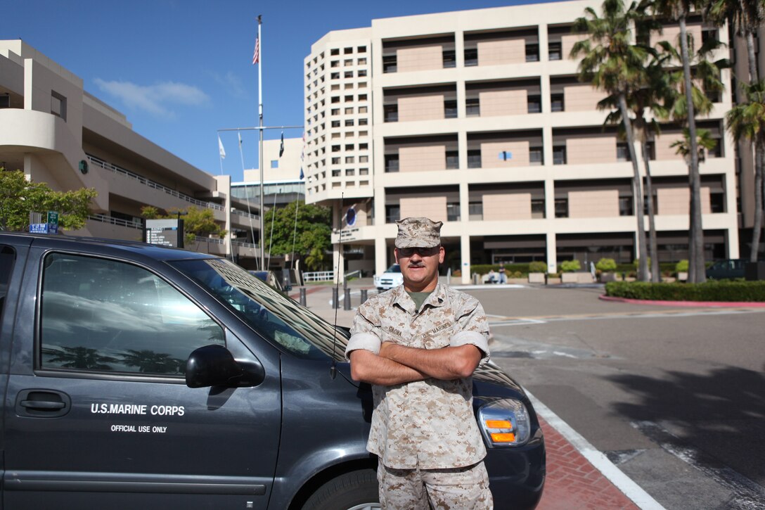 Sgt. George Gaona, a driver for the Wounded Warrior Battalion from La Puente, Calif., waits for a fellow Marine at the Balboa Naval Hospital. Due to a past injury, Gaona volunteered to work at the Wounded Warrior Battalion and help his fellow Marines as a driver, transporting them to and from medical appointments. (U.S. Marine Corps photo by Lance Cpl. John M. McCall)