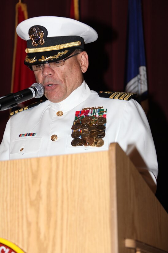 Navy Capt. Edgardo Perez-Lugo, the new Naval Health Clinic commanding officer, reads his orders to the audience at the Naval Health Clinic’s change of command ceremony, April 30. Lugo said it was an honor to replace such a respected commanding officer such as  Navy Capt. John B. Burgess Jr., former commanding officer of Cherry Point’s Naval Health Clinic.