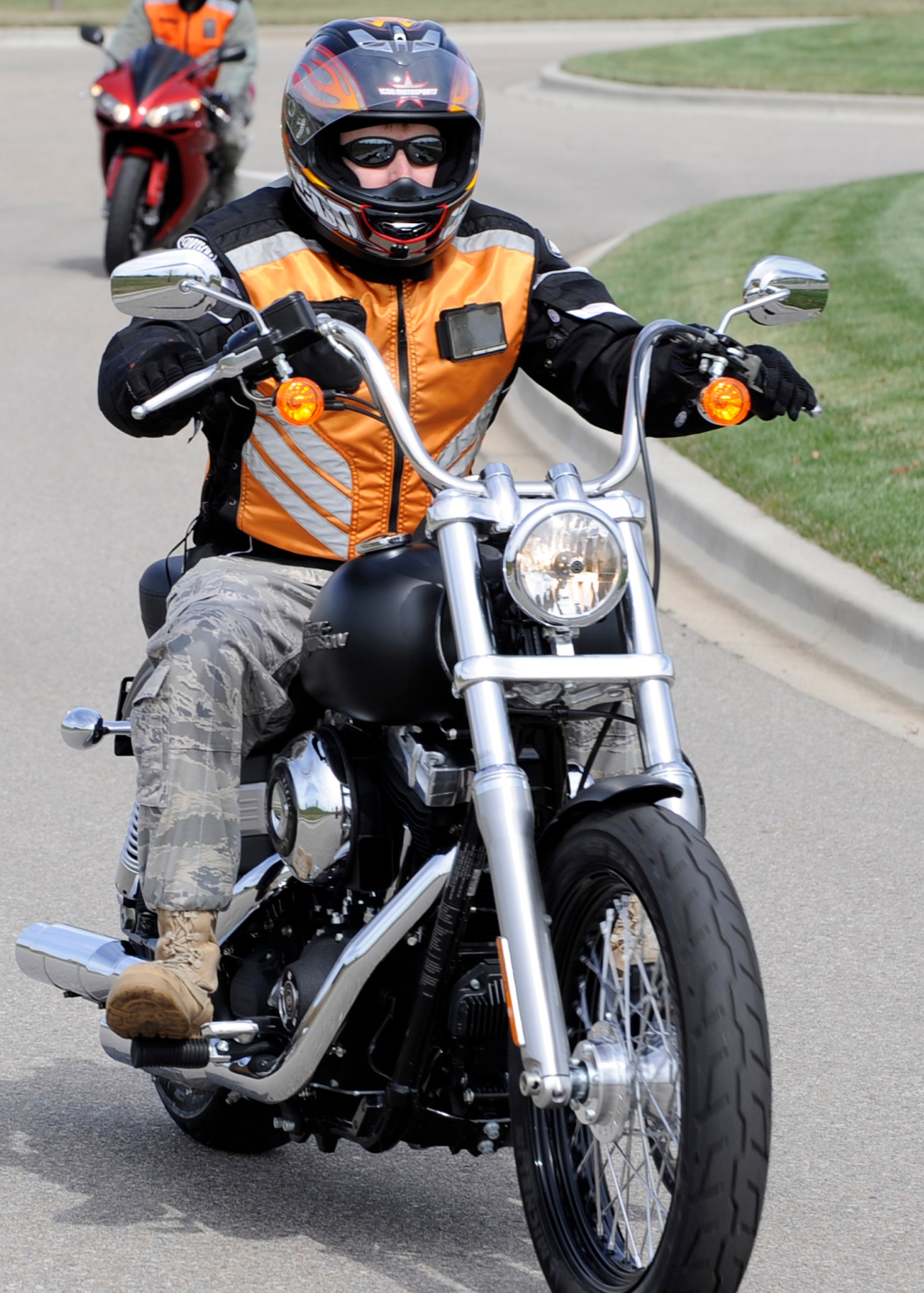 MOUNTAIN HOME AIR FORCE BASE, Idaho -- Motorcyclists should wear proper gear to include helmet, goggles or face shield, long sleeved shirt or jacket, long pants, full-fingered gloves and over the ankle footwear as shown in the photo. These kinds of precautions help ensure that lives are saved every day. (U.S. Air Force photo by Airman 1st Class Angelina Drake)