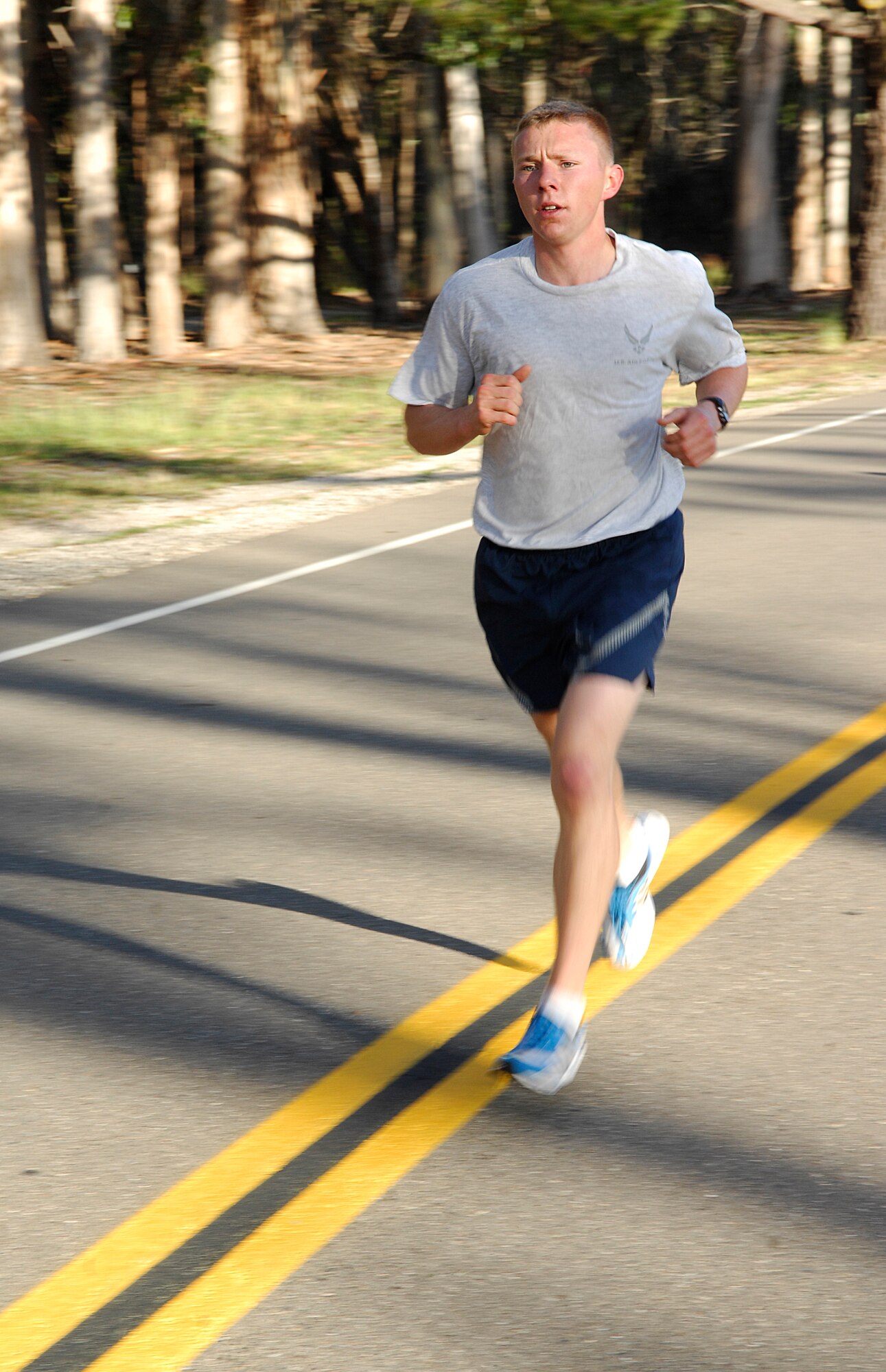 VANDENBERG AIR FORCE BASE, Calif. -- Leading the base, an Airman takes part in the 30th Space Wing 5K wing run here Friday, April 30, 2010. Airmen from the 30th Space Wing run together as a base every month. (U.S. Air Force photo/Senior Airman Heather R. Shaw)