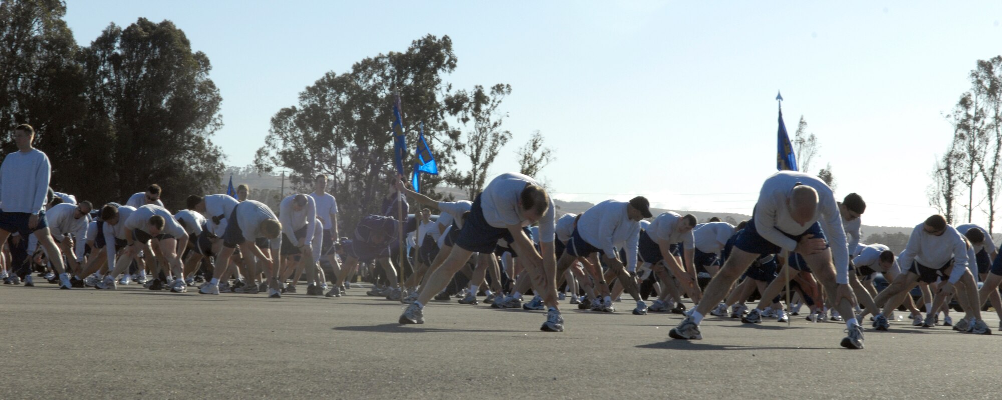 VANDENBERG AIR FORCE BASE, Calif. – Col. Richard Boltz, the 30th Space Wing commander, and Col. Steven Winters, the 30th SW vice commander, stretch after the Fit-to-Fight run as a group before being dismissed here Friday, April 30, 2010. In an effort to show wingman support Airmen waited for the very last runner to make it to the finish-line. (U.S. Air Force photo/Airman 1st Class Lael Huss)